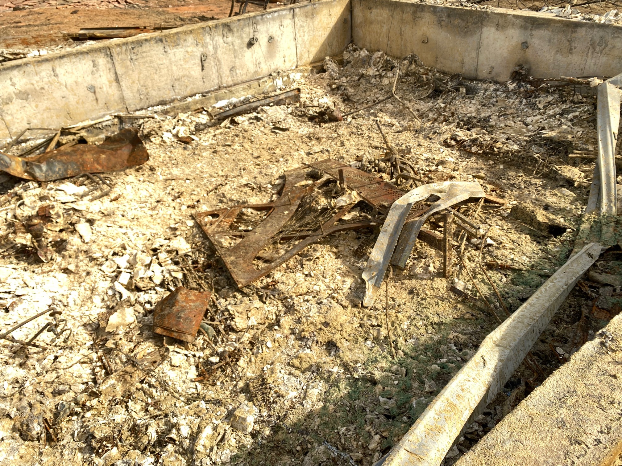 Eighty days since the Marshall fire destroyed this home on West Maple Street in Old Town Superior, remains of an old player piano waits to be hauled away. (Carol McKinley, The Denver Gazette)