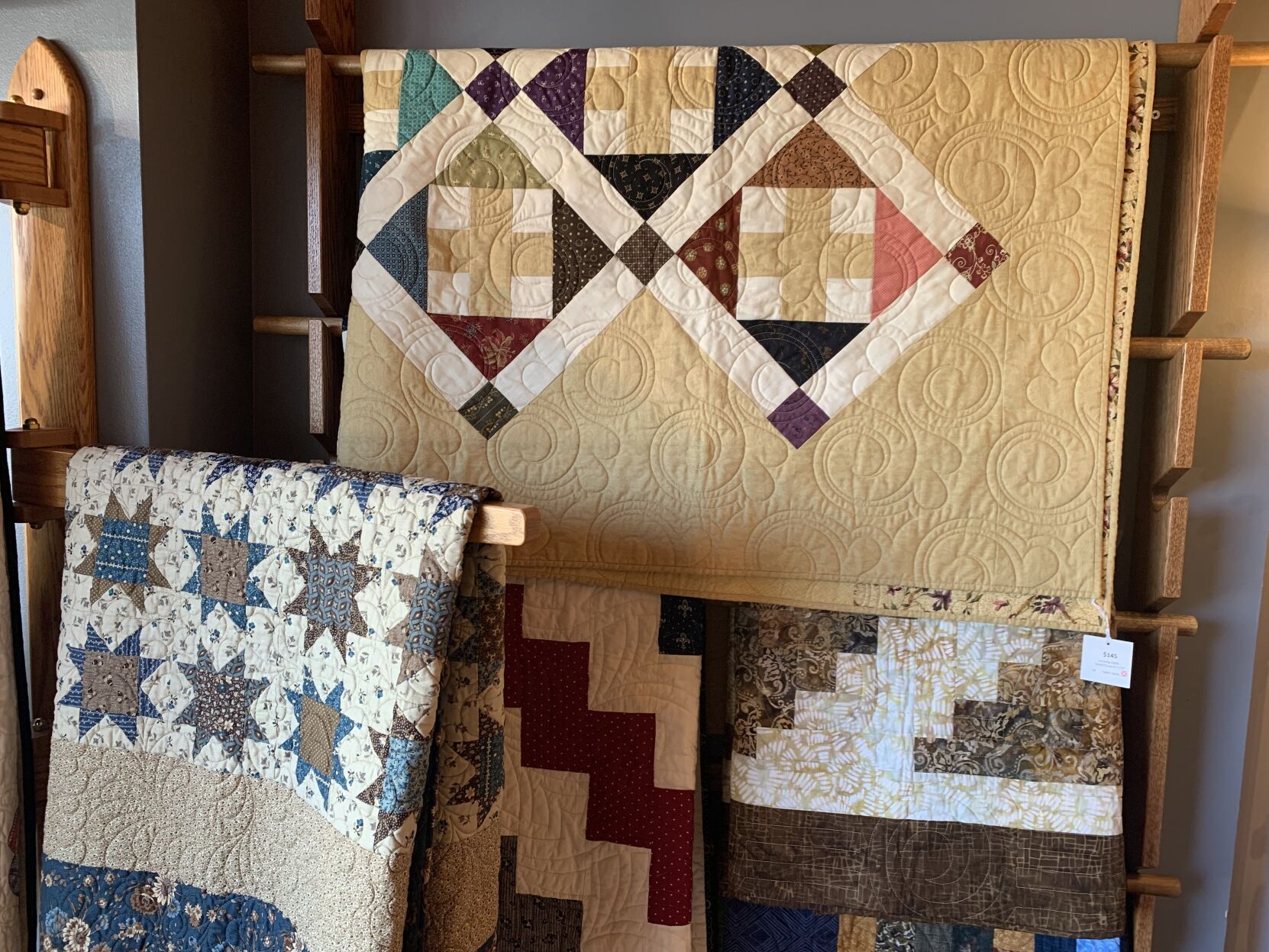 If you’re not ready to try your hand at quilting, you can often find handcrafted quilts for sale at quilt museums. Quilts pictured here are for sale at the Iowa Quilt Museum gift shop. You also can ask your city’s quilting guild where their members sell their work, or look on Etsy. (Courtesy of Iowa Quilt Museum)