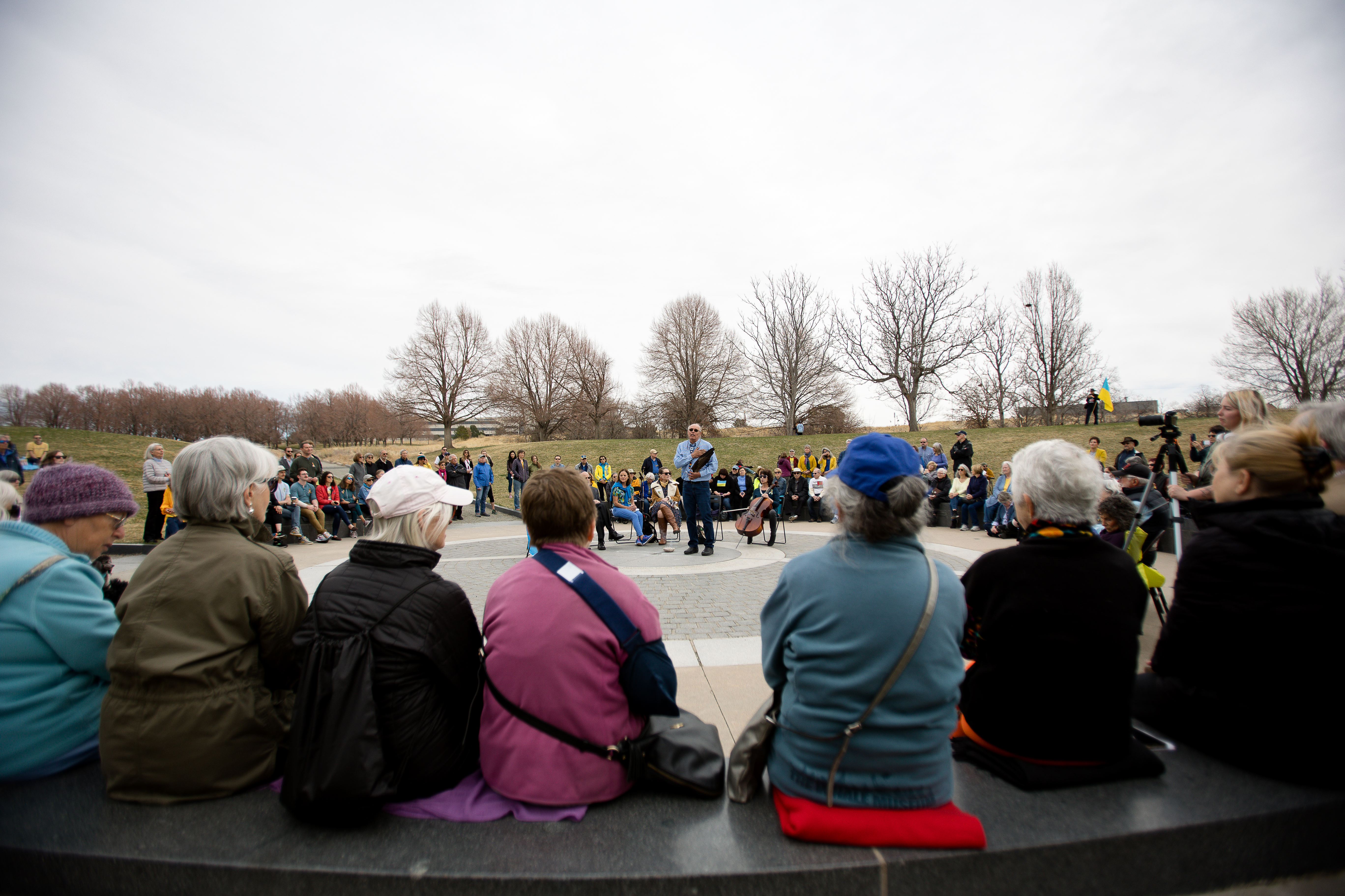 Rick Williams leads the group in a prayer during the Interfaith Gathering for Peace in Support of the Ukrainian People event Sunday, March 27 at Babi Yar Park. ((Sara Hertwig/for The Denver Gazette))