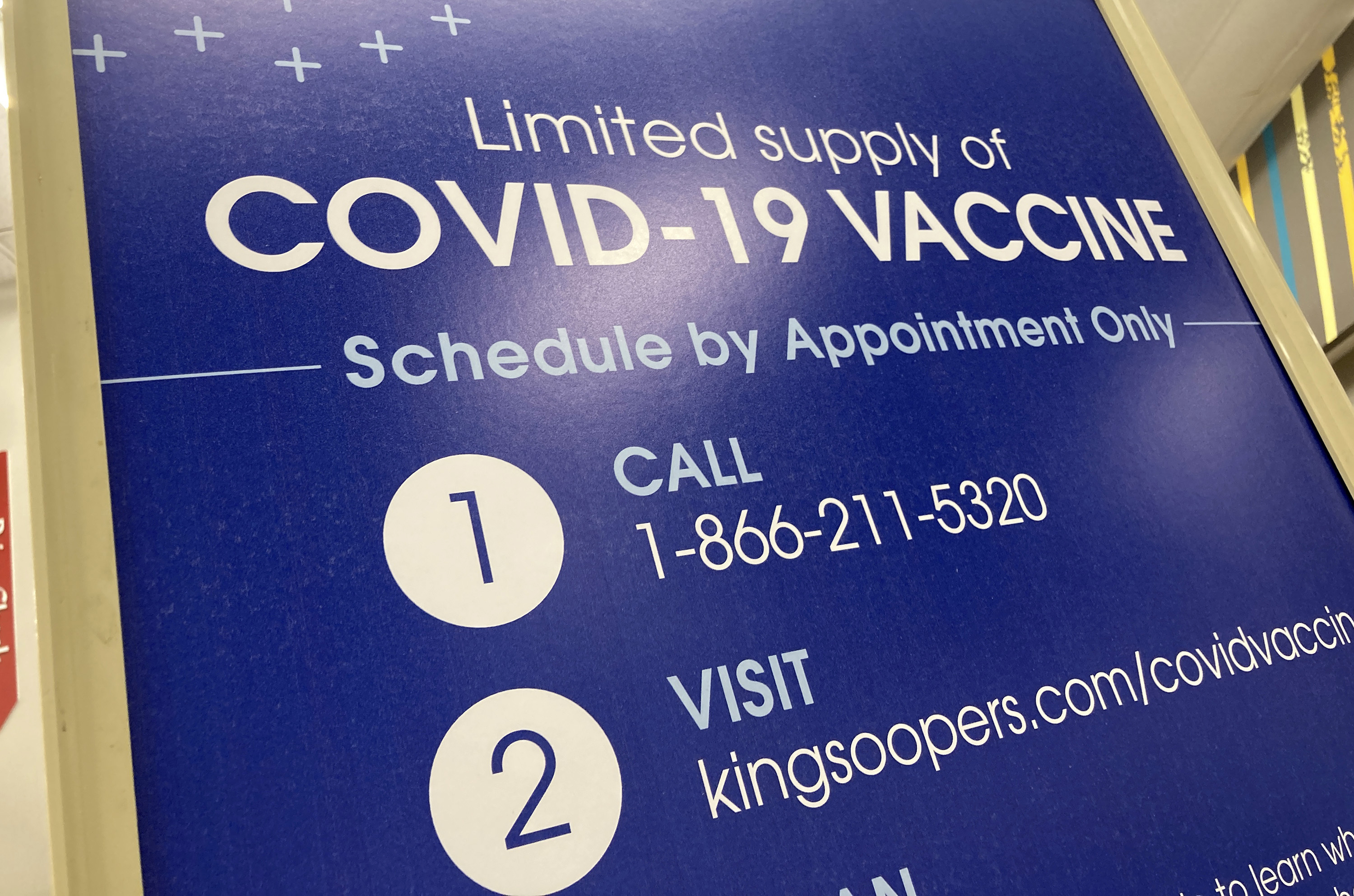 A sign to inform shoppers of the availability of COVID-19 vaccinations stands outside a pharmacy in a grocery store Wednesday, Nov. 3, 2021, in downtown Denver. (David Zalubowski - staff, AP)