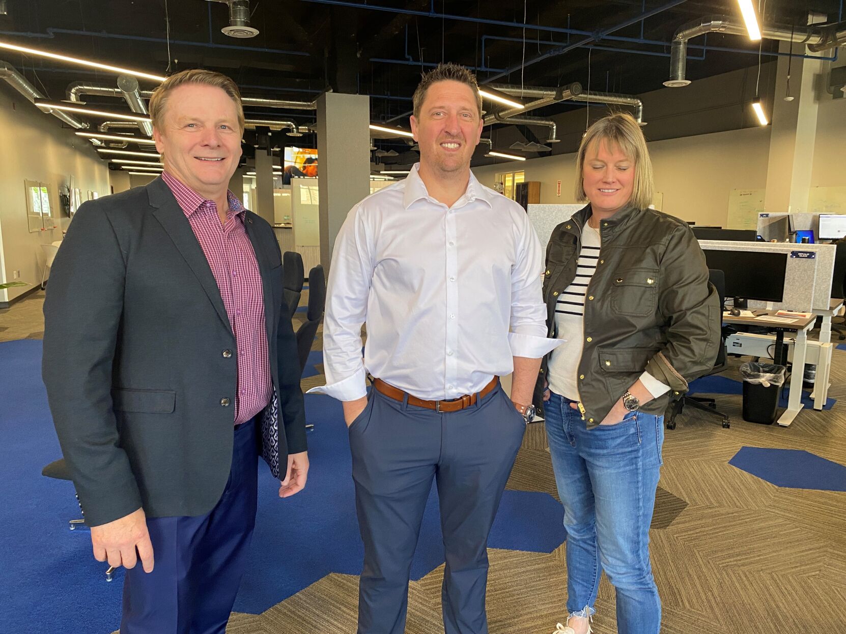 From left, Bluestaq executives Kevin O'Neil, partner; Seth Harvey, CEO and Rebecca Decker, chief operating officer, stand in front of the company's headquarters in downtown Colorado Springs. The Colorado Economic Development Commission Thursday approved $5.57 million in tax credits to help Bluestaq recruit and retain up to 585 employees during the next eight years at an average annual salary of nearly $190,000. (Wayne Heilman, The Gazette)