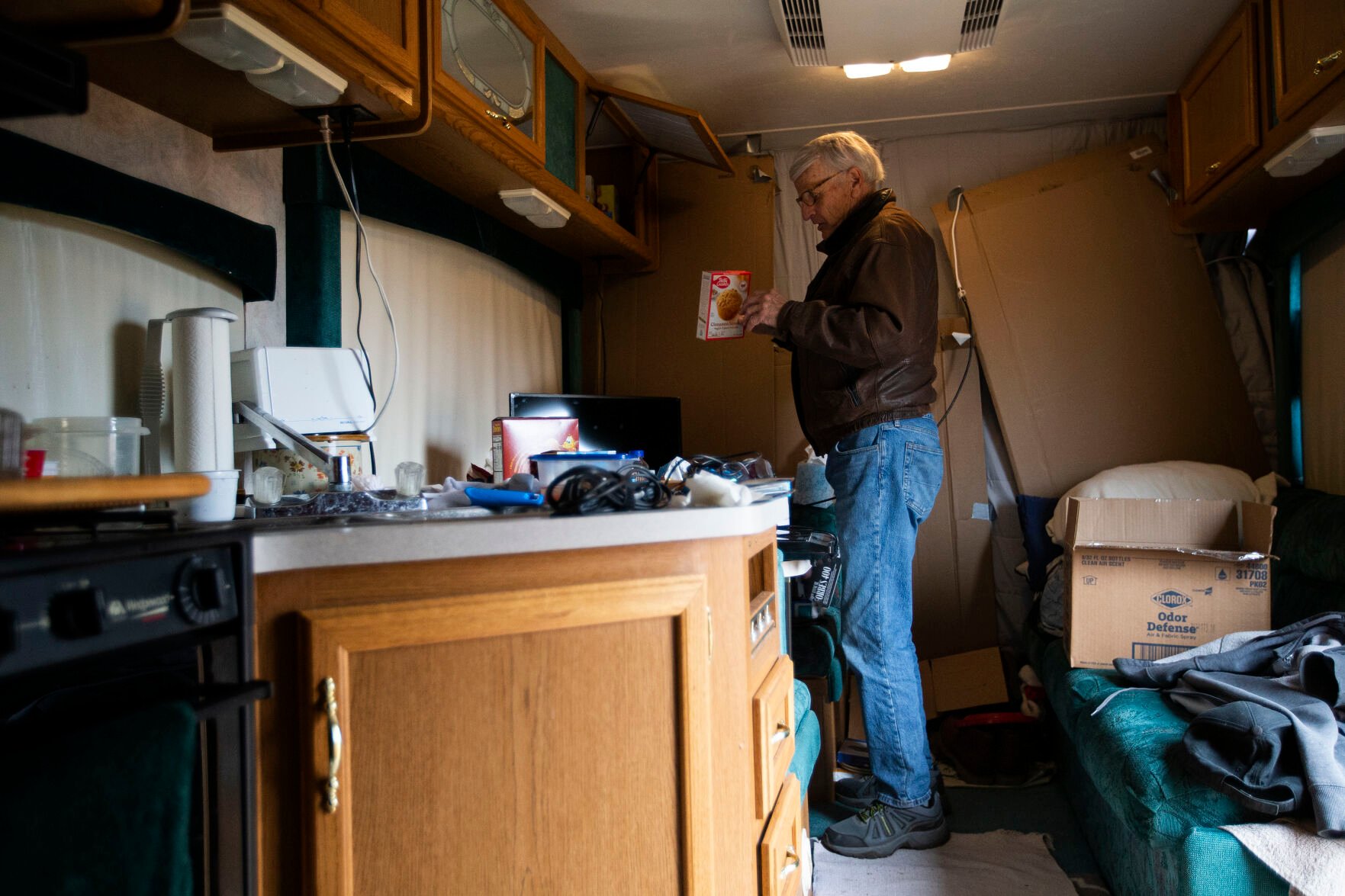 Superior resident Paul Williamson packs up food items in the camper that he’s been living in on his property in the Original Town neighborhood on Wednesday, March 16, 2022, in Superior, Colo. Williamson is planning to move into an apartment this Friday, but has been staying in the camper owned by his daughter. (Timothy Hurst/The Denver Gazette) (Timothy Hurst)