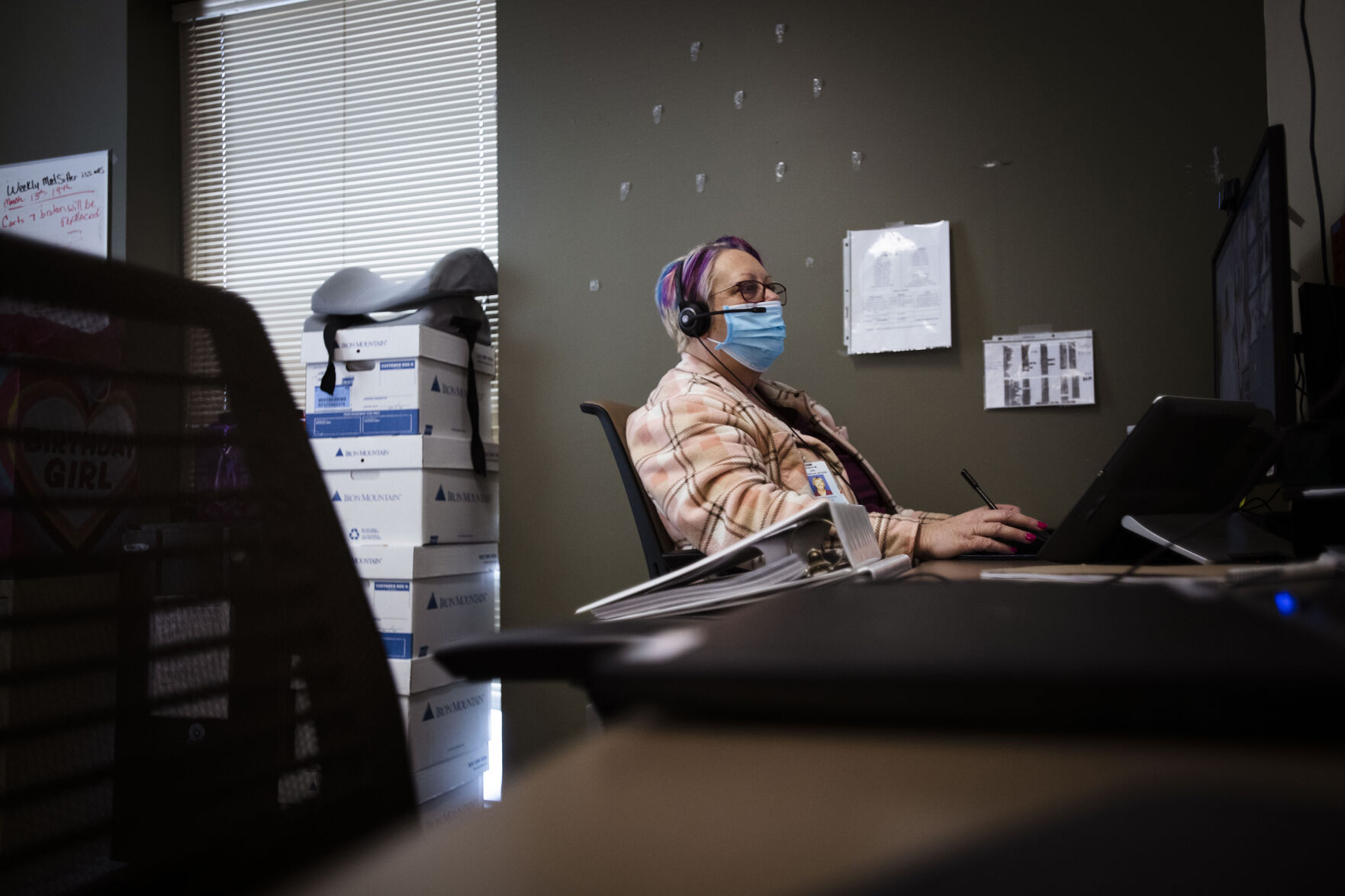 Debra Mireault, virtual telesitter, monitors patients using a new camera monitor system at St. Francis Hospital in Colorado Springs on Friday, March 25, 2022. Penrose- St. Francis is expanding the use of cameras that can monitor patients who might otherwise need a staff member in the room constantly. The cameras can monitor up to 10 patients. Hospitals, nursing homes and the broader health system face a long road to recovery from the staffing shortages. (Chancey Bush/ The Gazette) (Chancey Bush/ The Gazette)