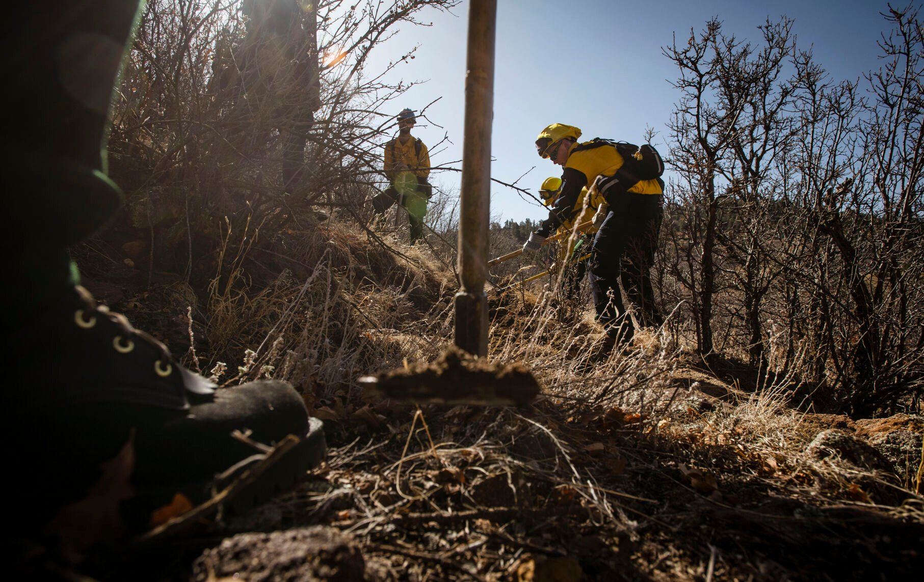 Students work on digging a fire line during the Colorado Wildland Fire and Incident Management Academy’s outdoor field day at the campus of University of Colorado at Colorado Springs on Friday, March 26, 2022. (Chancey Bush/ The Gazette) (Chancey Bush/ The Gazette)
