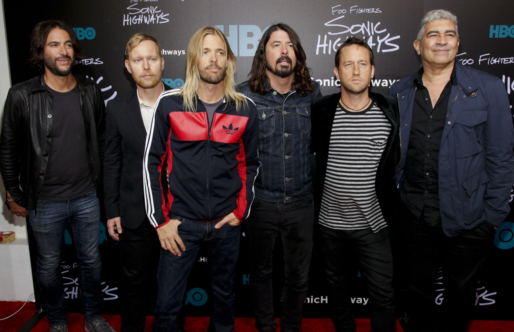 Rami Jaffee, from left, Nate Mendel, Taylor Hawkins, Dave Grohl, Chris Shiflett and Pat Smear attend the premiere of HBO's
