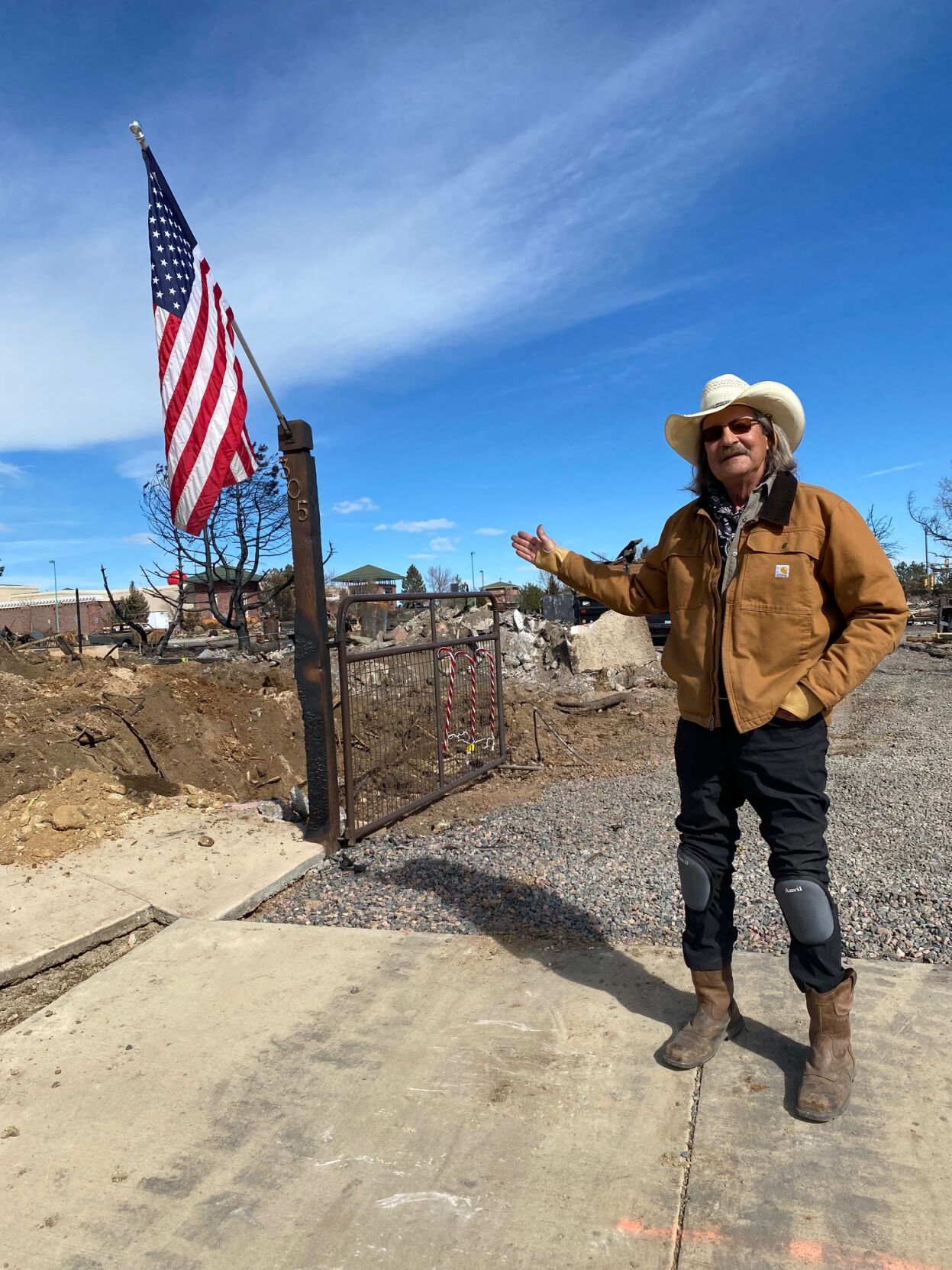 Ross Morgan followed Williamson's lead and started cleanup on his three lot parcel himself. He has hired a contractor to haul away the remnants of the family home which he built to envelope a 1910 miner's camp cabin. (Carol McKinley)