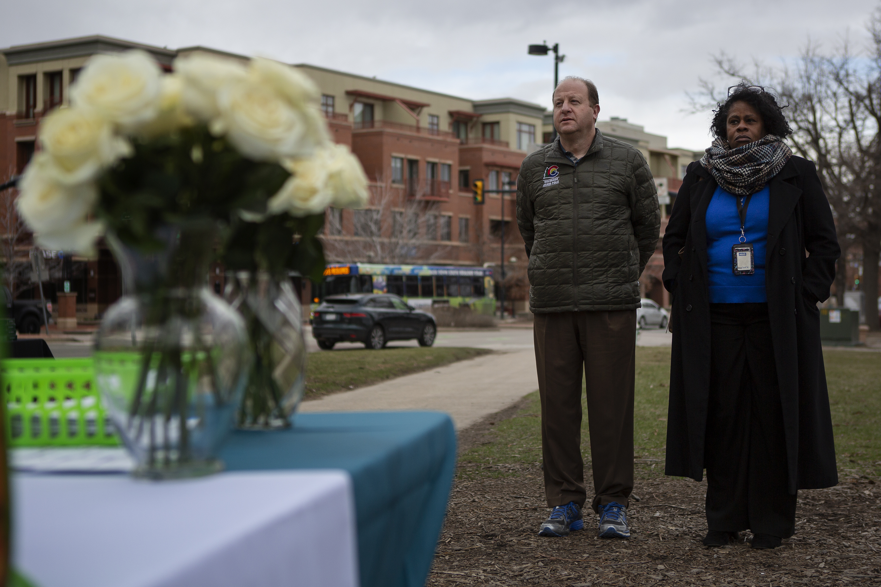 Gov. Jared Polis stands with Boulder assistant city manager Yvette Bowden during a Communitywide Day of Remembrance gathering at the Glen Huntington Bandshell on Tuesday, March 22, 2022, in Boulder, Colo. (Timothy Hurst/The Denver Gazette) (Timothy Hurst)