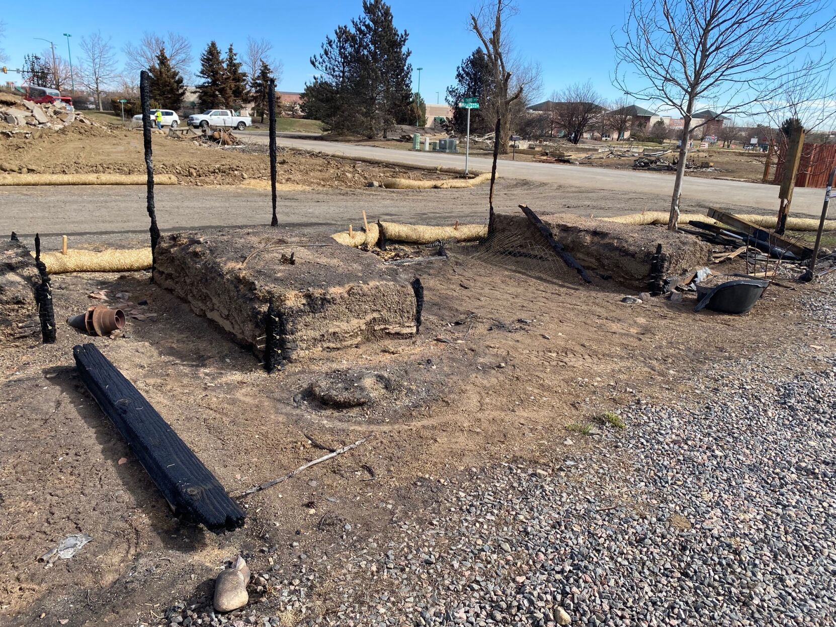 These rectangle rows of sod used to be the Morgans' garden boxes. The Marshall fire disintegrated the wooden frames leaving only the dirt behind. (Carol McKinley)