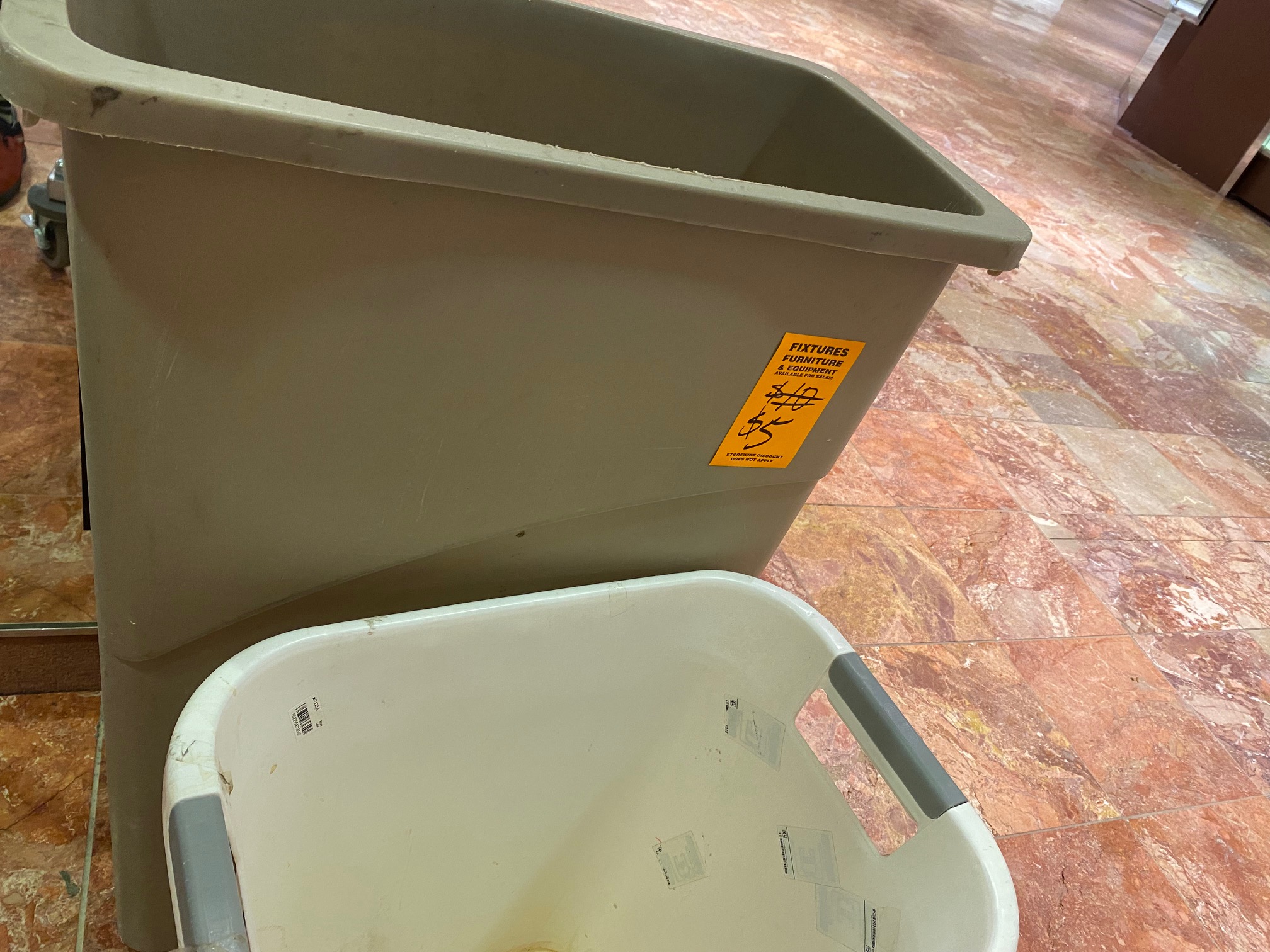 Trash cans marked down from $10 to $5 at the Southglenn Macy's store closing sale. (Carol McKinley, The Denver Gazette)