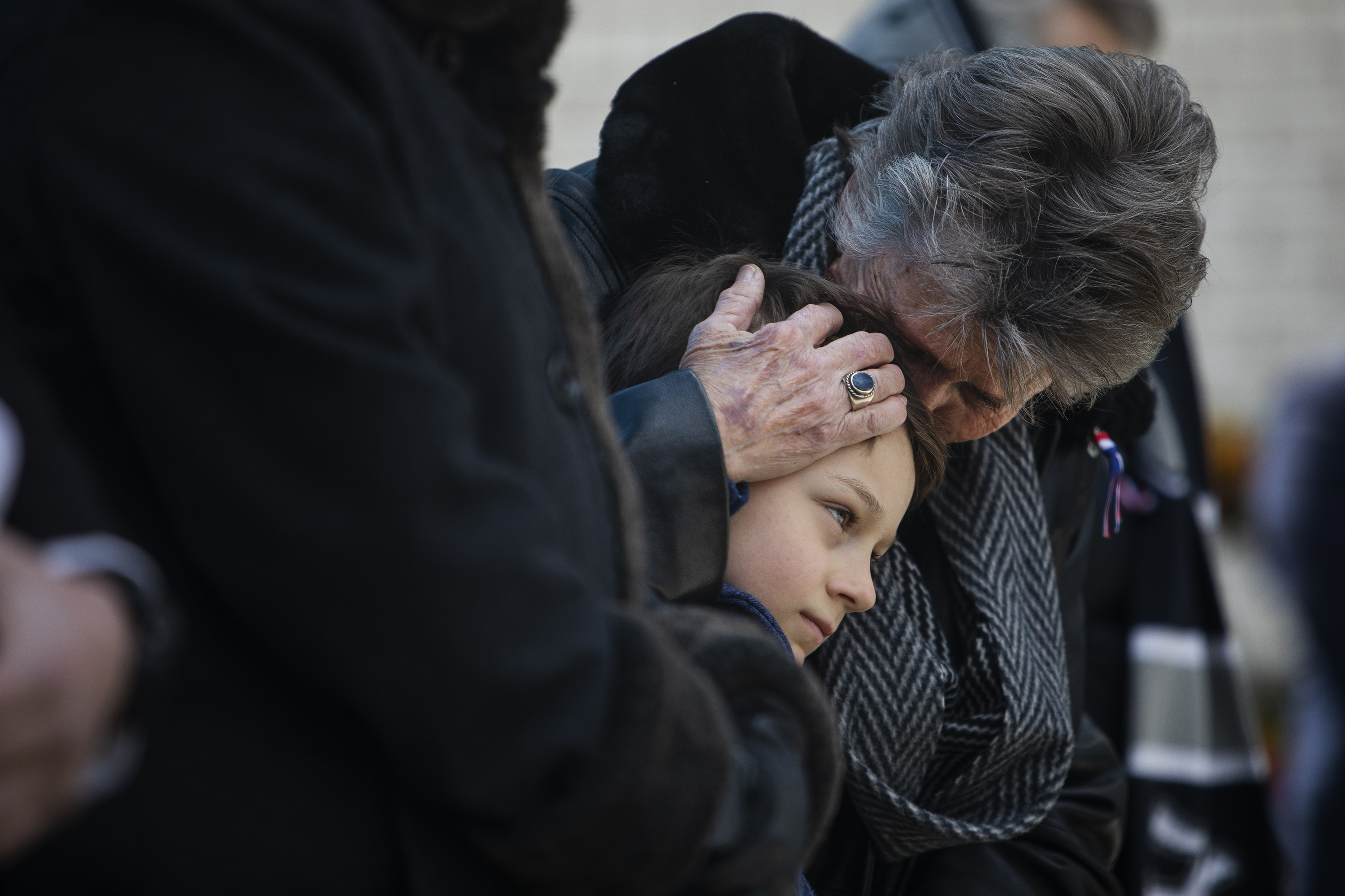 Slain Boulder police officer Eric Talley’s mother Judy Talley embraces one of her grandchildren during a Line of Duty Death commemoration for officer Eric Talley at the Boulder Police Department on Tuesday, March 22, 2022, in Boulder, Colo. (Timothy Hurst/The Denver Gazette) (Timothy Hurst)