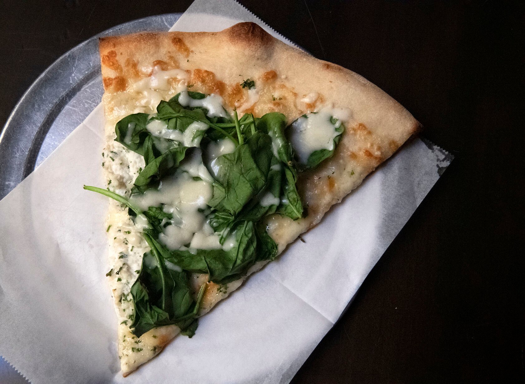 Scileppi’s Restaurant (Located at: 210 3rd Street, Castle Rock, CO.) “White Spinach Pizza” Thursday March 24, 2022. Photo by Jeff Kearney. (Jeff Kearney)