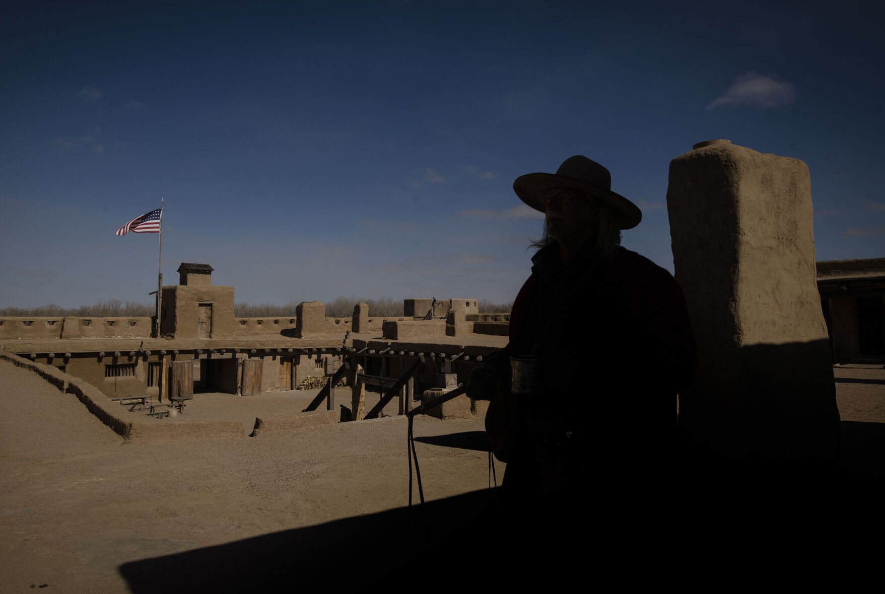 Bob Kisthart, a historical interpreter, looks out on Bent’s Old Fort National Historic Site in La Junta. (Chancey Bush/ The Gazette)