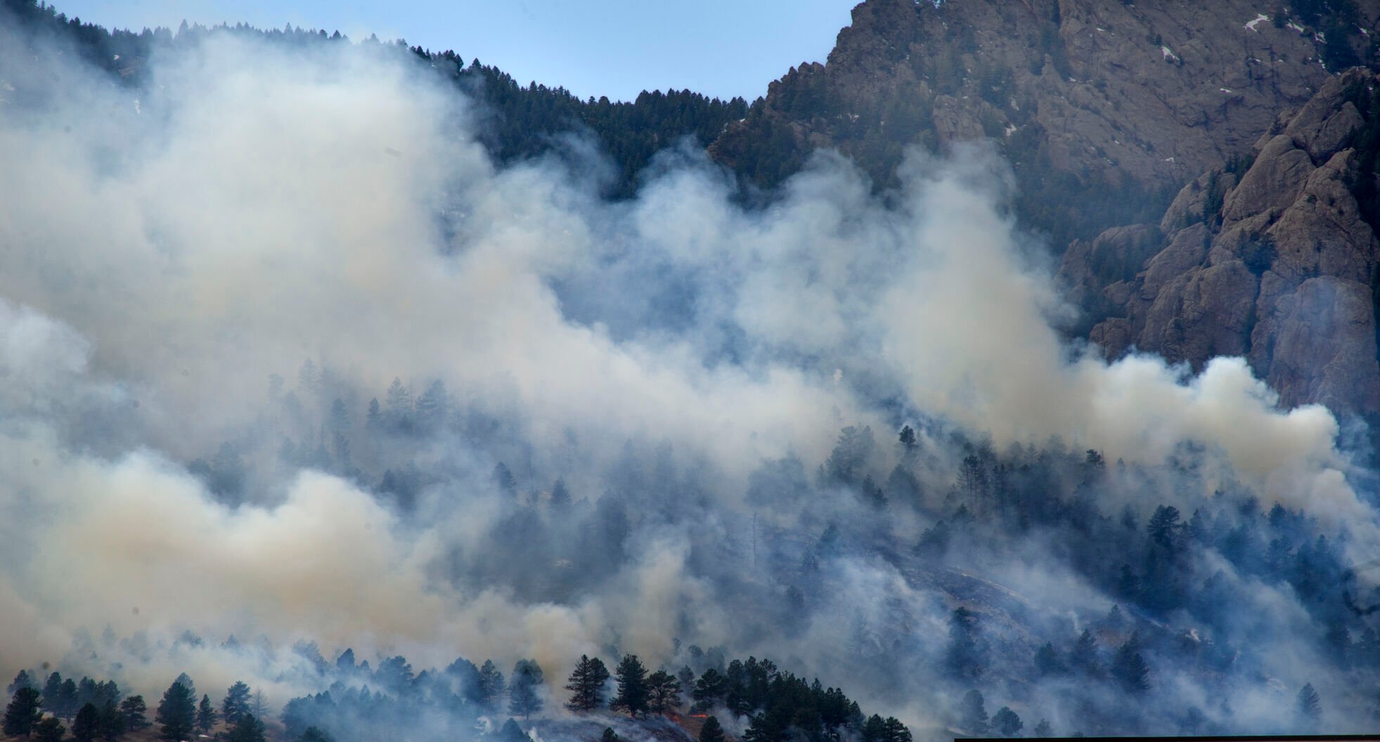 Smoke from the NCAR Fire obscures the foothills on March 26, 2022, in Boulder, Colo. Jacob Byk/For The Denver Gazette
