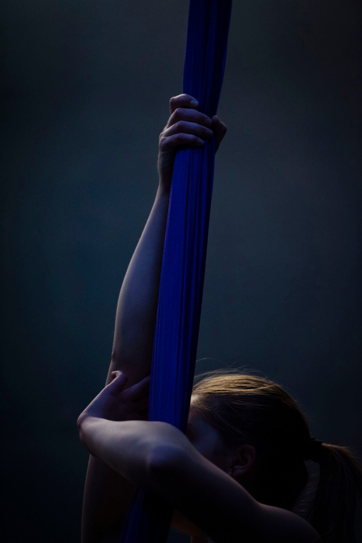 Adalyn Brown, 12, holds onto the silk fabric while practicing her technique during a teen intermediate aerial silk class at the Urban Cirque studio in Colorado Springs on Tuesday, March 15, 2022. Owner Katrina Diaz opened her studio in January, where she shares her passion of circus-style fitness with teens and adults, teaching the art of silks, hoops and aerial fitness ranging from beginner to intermediate classes. (Chancey Bush /The Gazette) (Chancey Bush/ The Gazette)