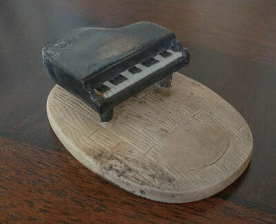 Schroeder's ceramic piano was the only one of three pianos in the home to survive the fire. (Courtesy Kelly Watt)