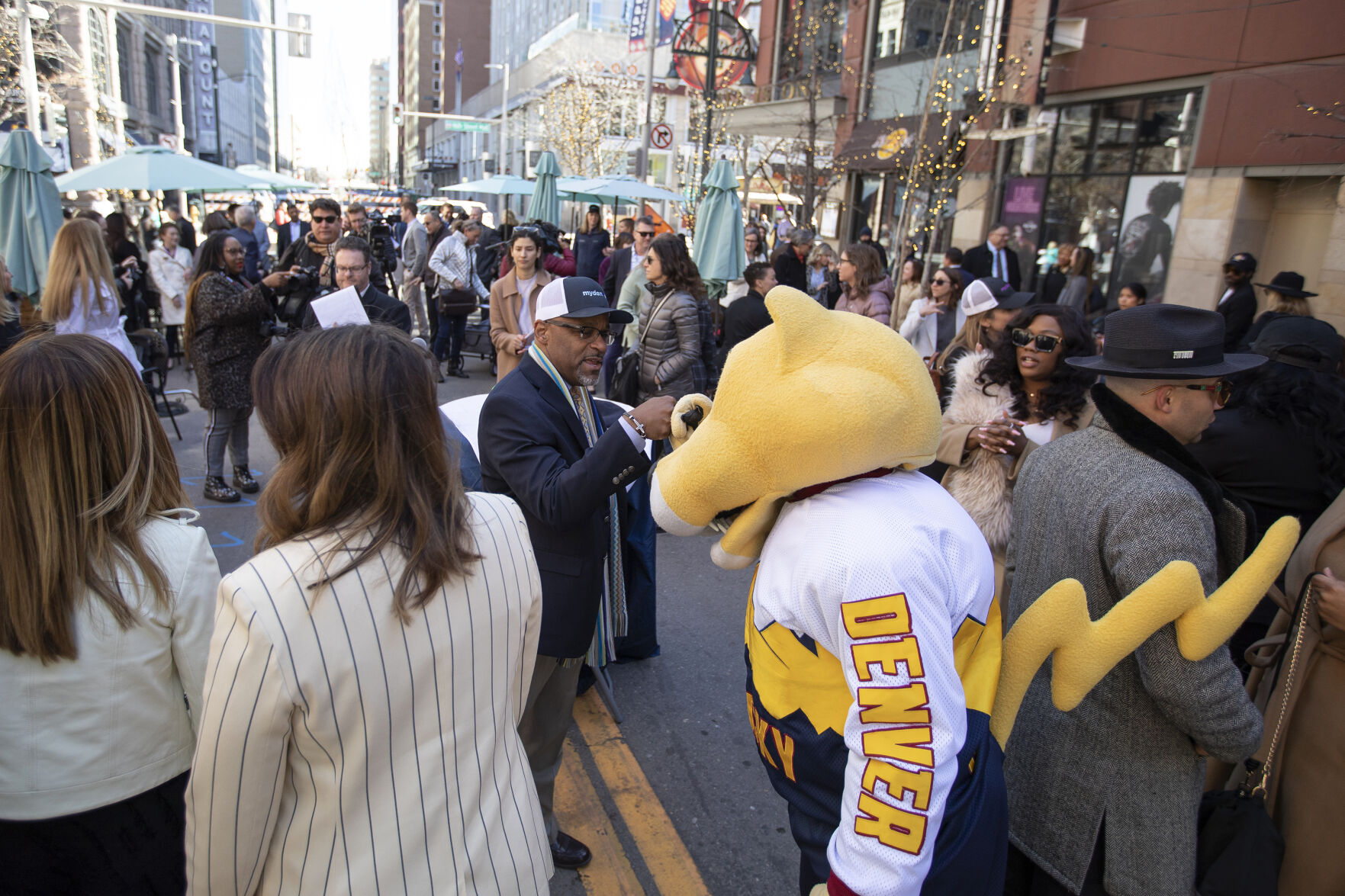 Mayor Michael B. Hancock fist-bumps Nuggets mascot Rocky after a press conference discussing downtown Denver’s recovery from the COVID-19 pandemic at the Glenarm Plaza on Thursday, April 7, 2022, in Denver, Colo. (Timothy Hurst/The Denver Gazette) (Timothy Hurst)