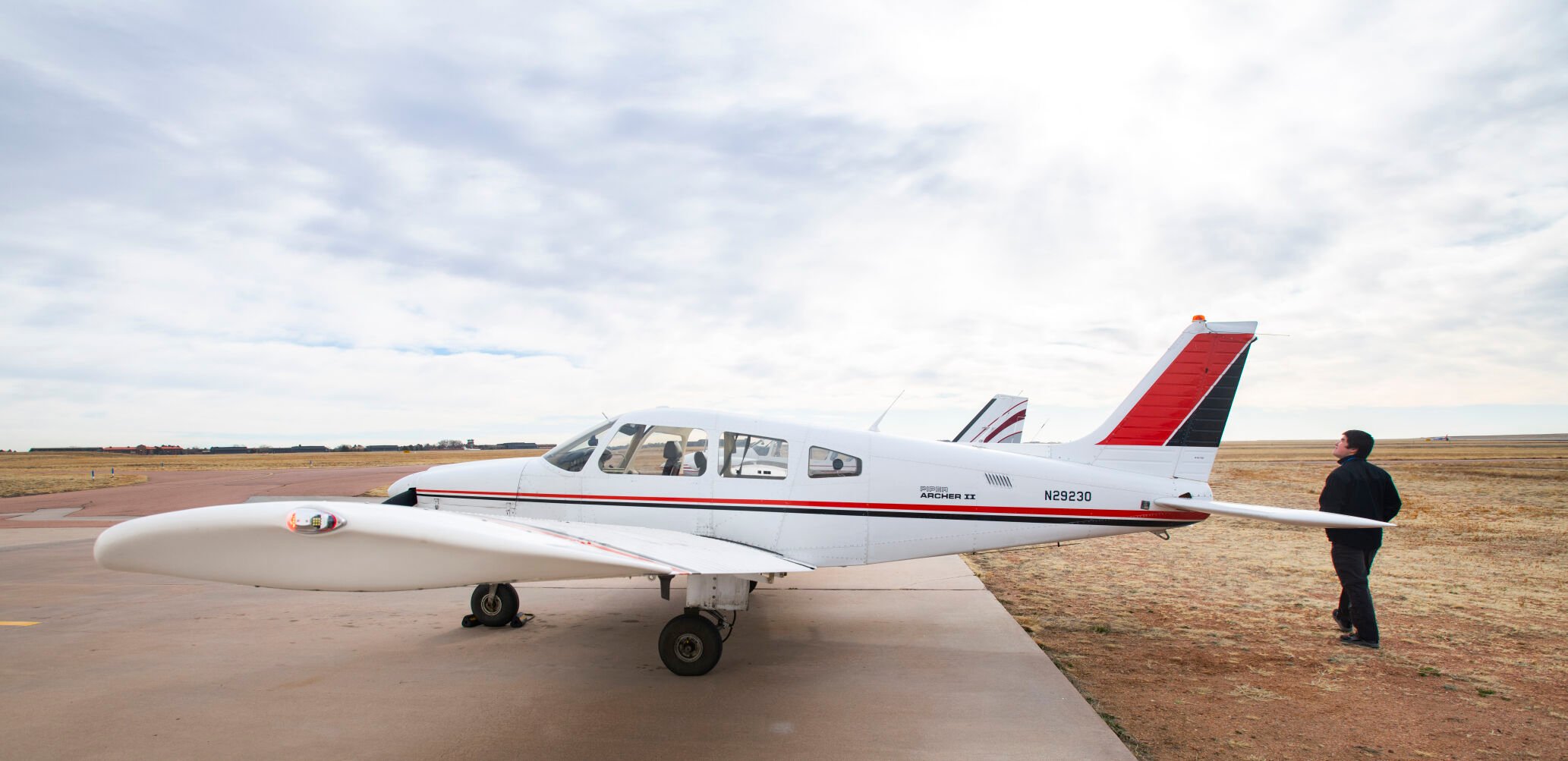 Metropolitan State University of Denver freshman Nolan Shell does a preflight check on a Piper airplane Monday, March 28, 2022, while taking classes at Direct Connect Flight Academy at the Colorado Springs Airport. Shell has logged more than 60 hours of flight time and has earned his private pilot license since starting the program in the fall. (The Gazette, Christian Murdock) (Christian Murdock/The Gazette)