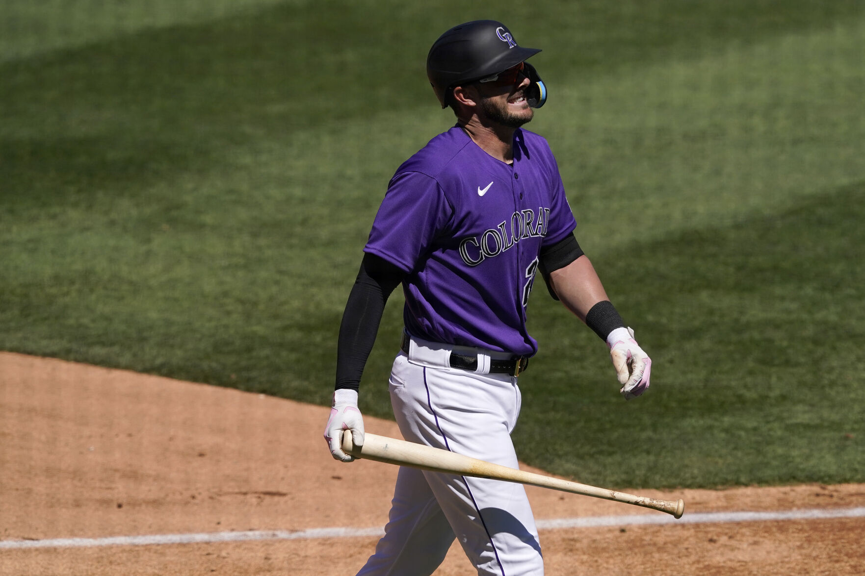 Colorado Rockies' Kris Bryant walks to the dugout after striking out against the Los Angeles Dodgers during the second inning of a spring training baseball game, Thursday, March 24, 2022, in Scottsdale, Ariz. (AP Photo/Matt York) (Matt York)