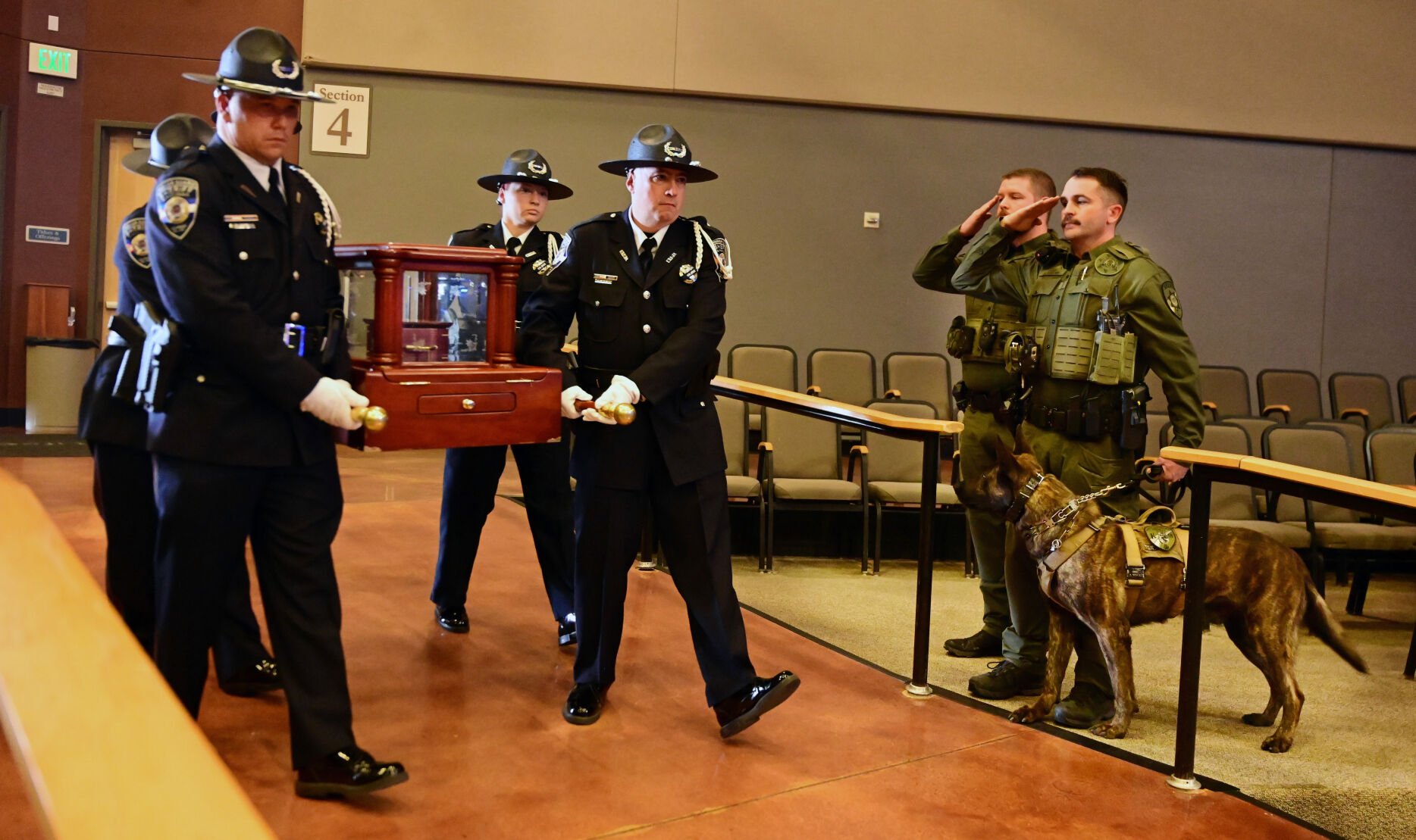 The remains of Jinx, a K9 police dog, are carried by an honor guard with the El Paso County Sheriff’s Office at the beginning of a memorial service Thursday. (Jerilee Bennett, The Gazette)