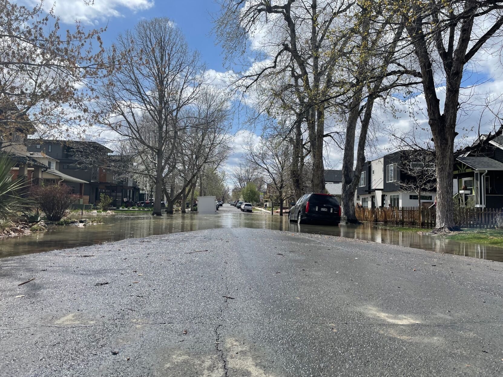 Parts of a street are flooded from a water main break in the Berkeley neighborhood that occurred Sunday, April 24, 2022. (Lindsey Toomer, Denver Gazette) (Lindsey Toomer, Denver Gazette)