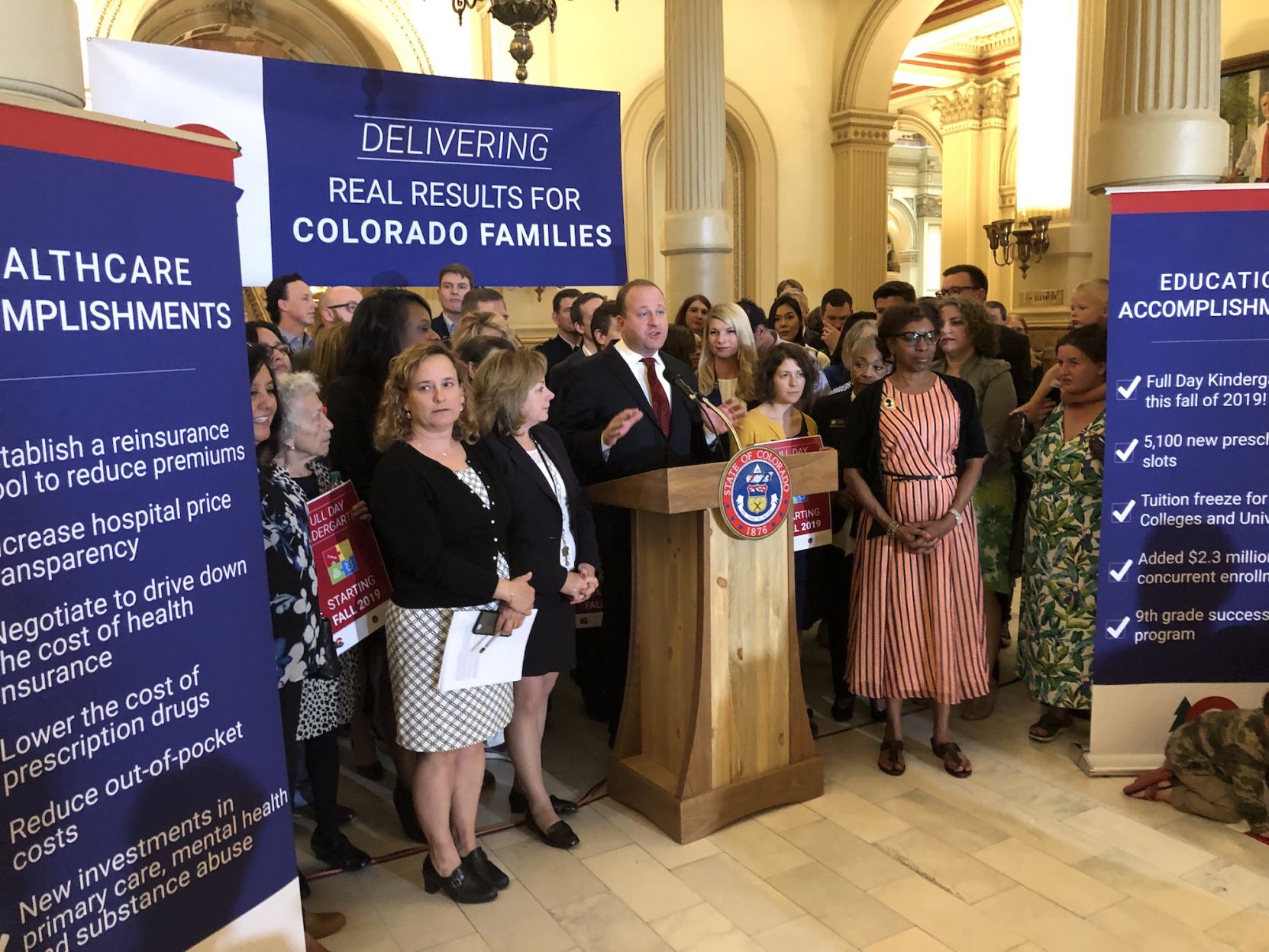 Gov. Jared Polis celebrates with fellow Democrats at the state Capitol after passing a raft of health care-related legislation at the end of the 2019 legislative session. (JoeyBunchjoey.bunch@coloradopolitics.comhttps://secure.gravatar.com/avatar/66505e98f9e3fed10e6a3b9a1fc4ca22?d=mm&r=g)