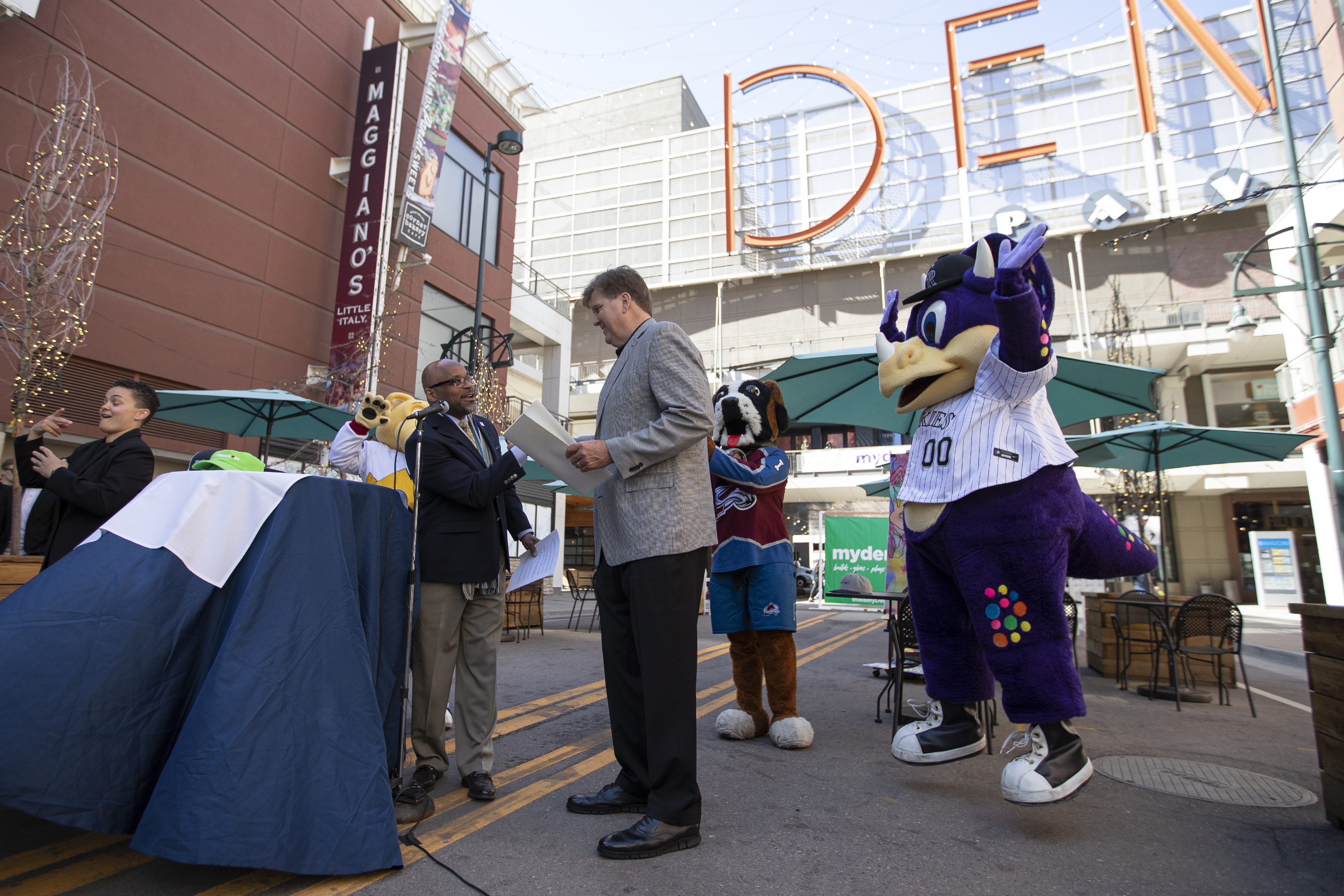 Michael B. Hancock and Rockies President and chief operating officer Gregory Feasel shake hands during a press conference discussing downtown Denver’s recovery from the COVID-19 pandemic at the Glenarm Plaza on Thursday, April 7, 2022, in Denver, Colo. (Timothy Hurst/The Denver Gazette) (Timothy Hurst)