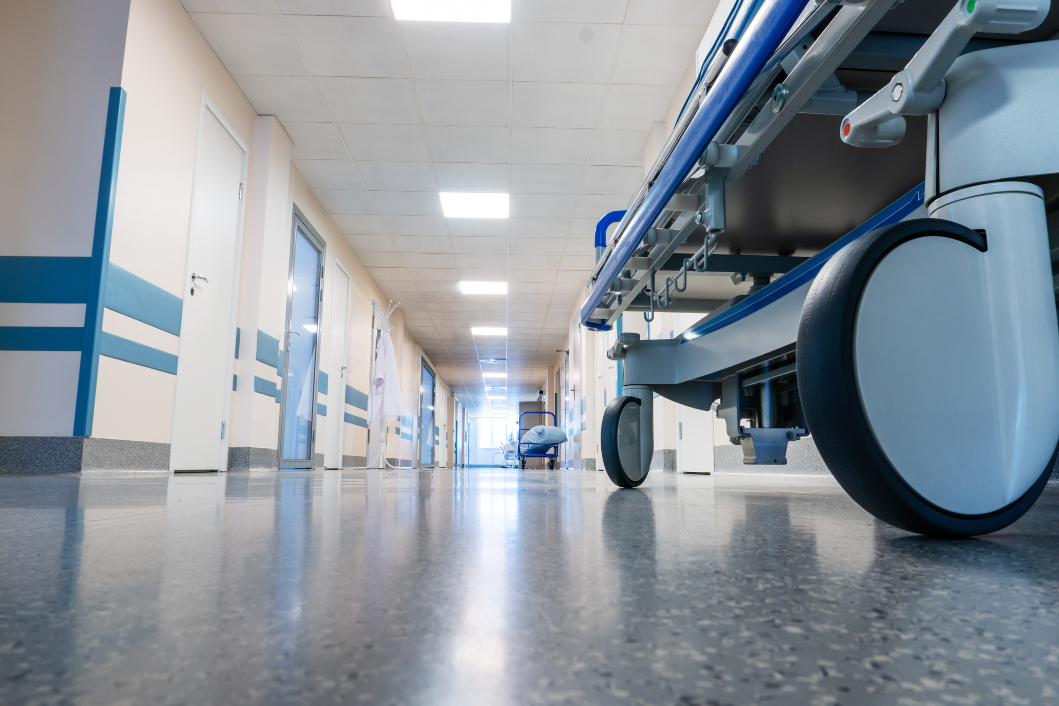 Medical bed on wheels in the hospital corridor. View from below. (beerkoff)
