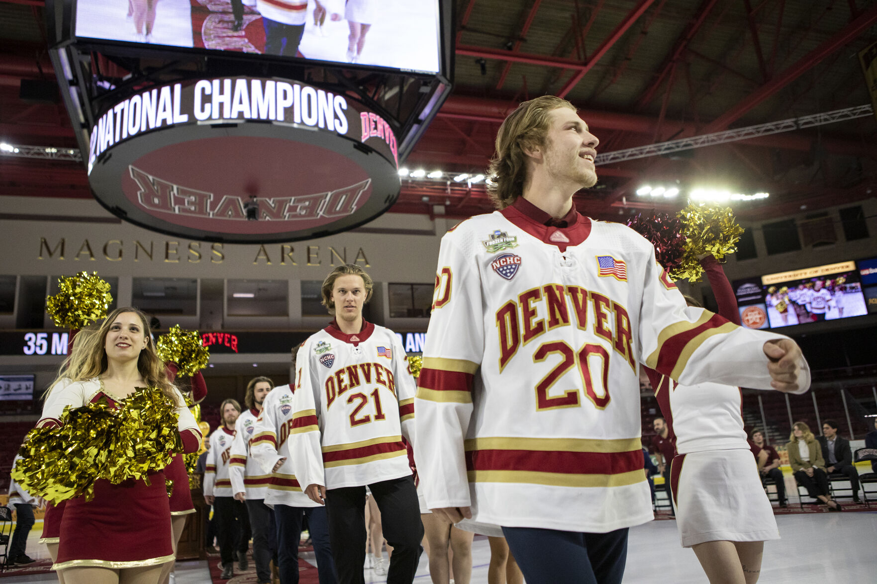 University of Denver sophomore defenseman Mike Benning, front, looks to the crowd as the team exits the ice during the 2022 National Championship Celebration on Tuesday in Denver. (Timothy Hurst, the gazette)