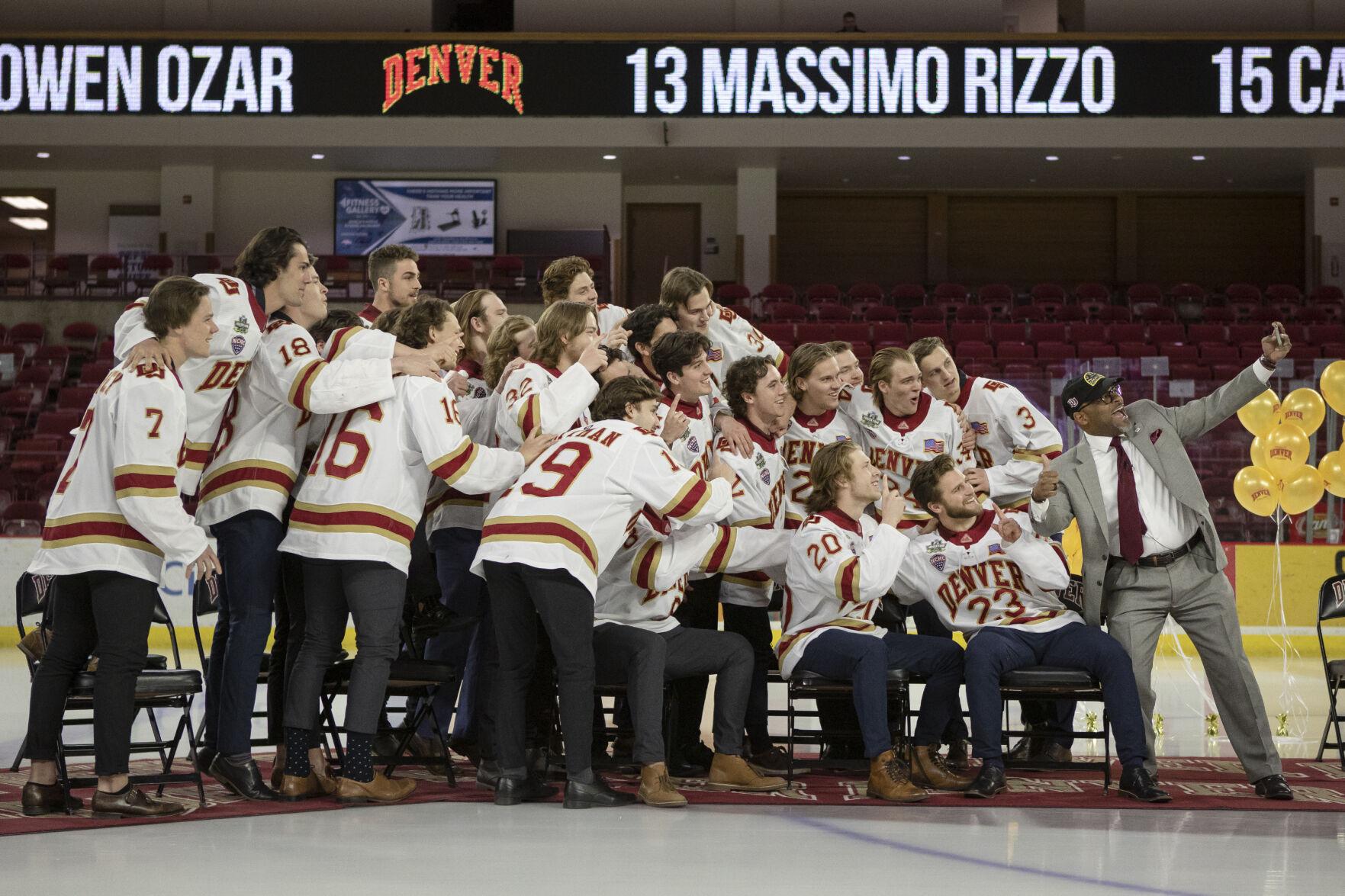 Denver Mayor Michael Hancock, right, takes a selfie with the University of Denver Men’s Hockey Team during the 2022 National Championship Celebration on Tuesday, April 12, 2022, at Magness Arena in Denver, Colo. (Timothy Hurst/The Denver Gazette) (Timothy Hurst, The Denver Gazette)