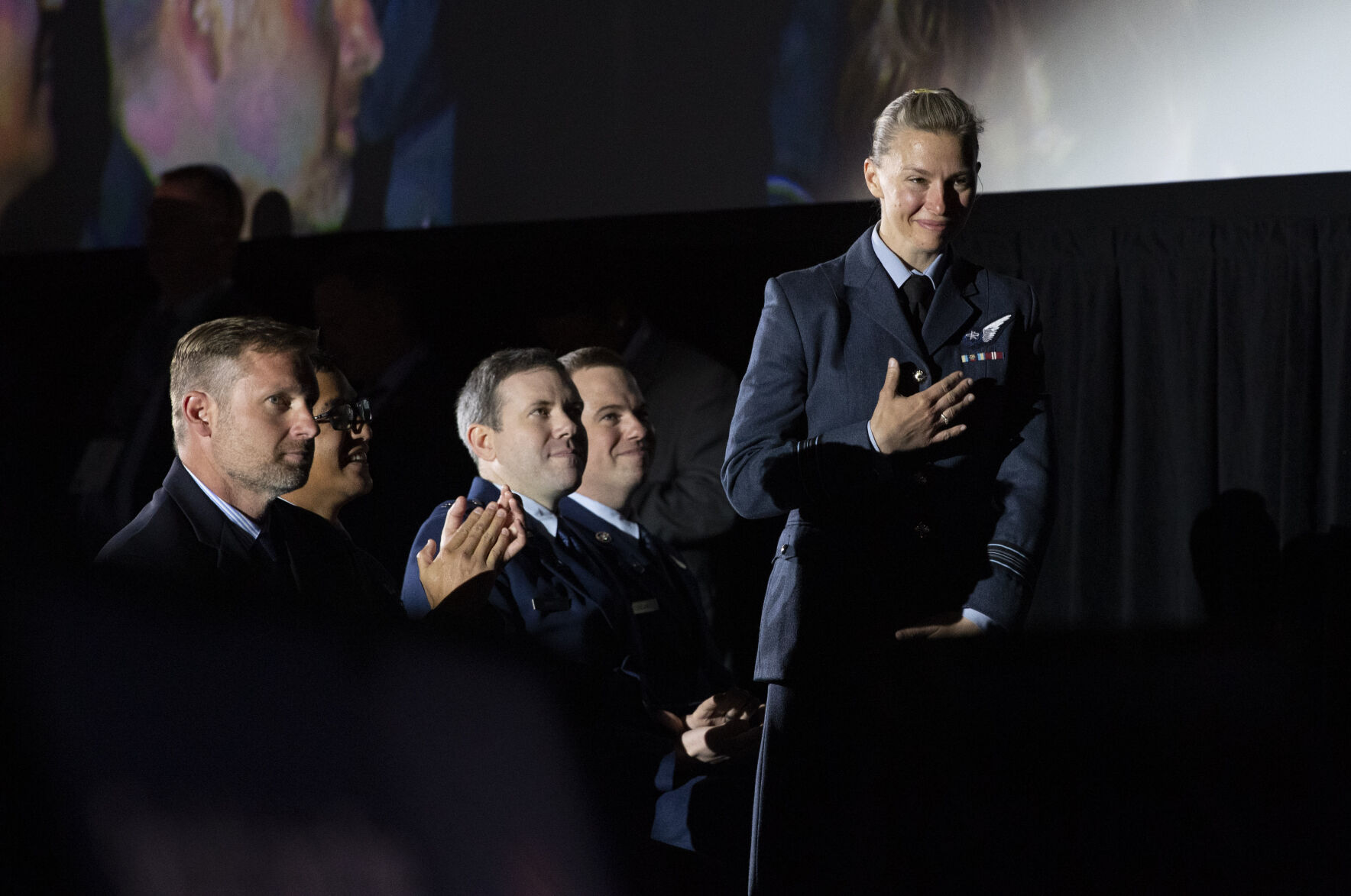 Royal Air Force Sqd Leader Louise Page stands to be recognized by Gen. John W. “Jay” Raymond, Chief of Space Operations, U.S. Space Force, during his talk Tuesday, April 5, 2022, during the 37th Space Symposium at The Boardmoor in Colorado Springs. (The Gazette, Christian Murdock) (Christian Murdock/The Gazette)