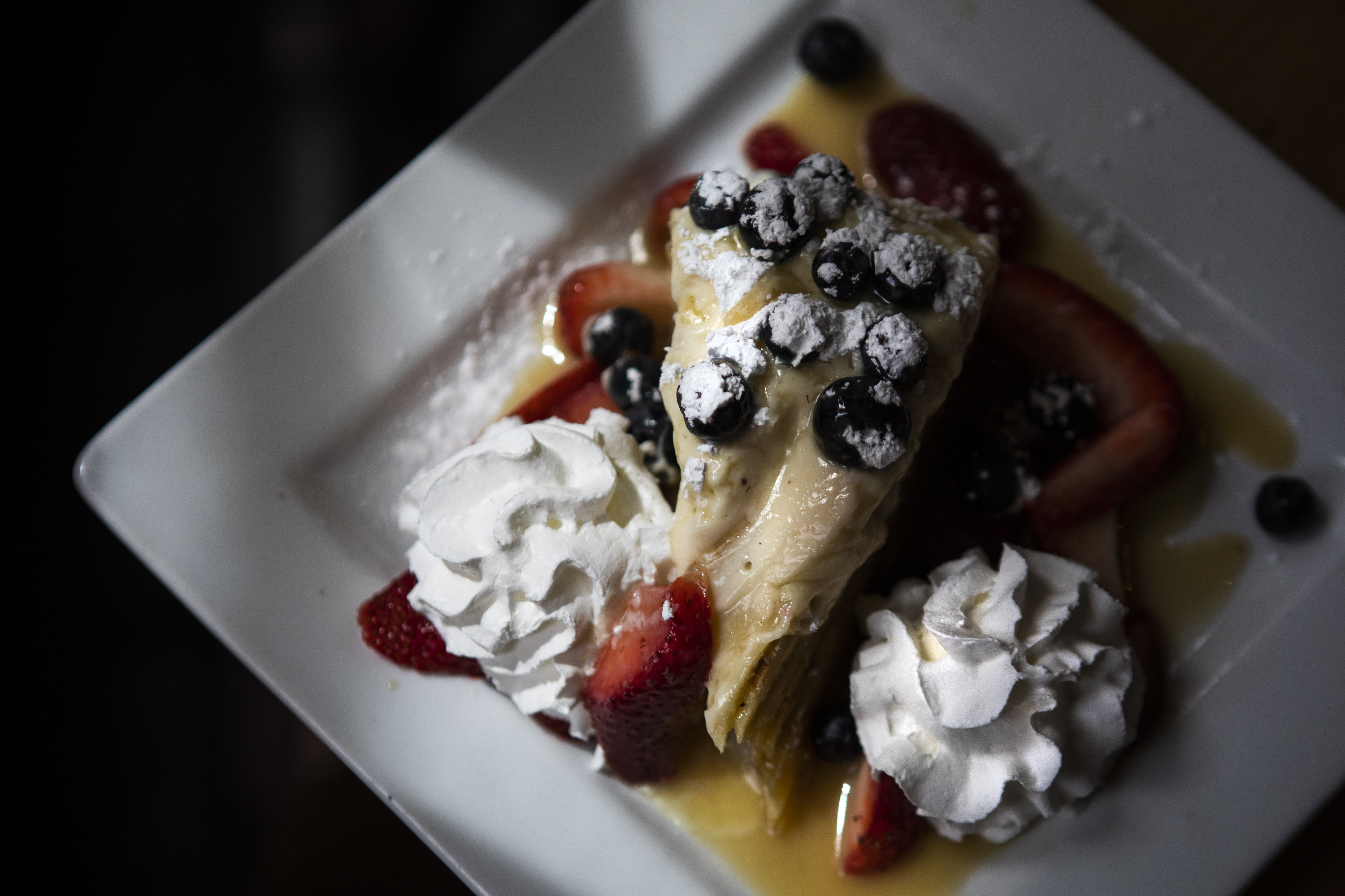 The Butter Rum Caramel Crêpe Cake is a stack of crêpes that blurs the line between breakfast and dessert, as seen on Wednesday, April 13, 2022, at Foolish Craig’s Cafe in Boulder, Colo. (Timothy Hurst/The Denver Gazette) (Timothy Hurst)