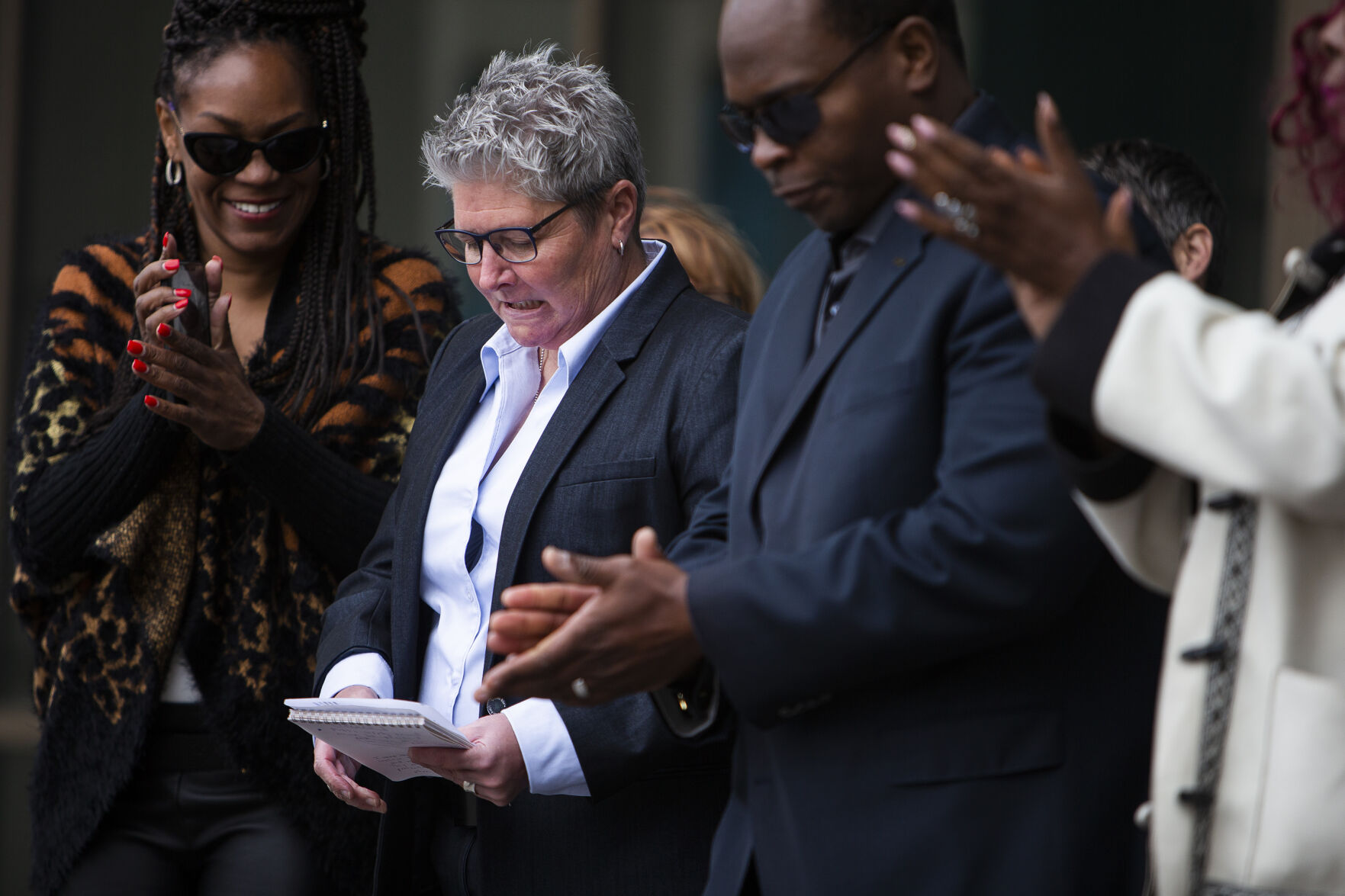 Former Aurora Police Chief Vanessa Wilson is applauded Monday at the Aurora Municipal Center in Aurora. (Timothy Hurst, The Denver Gazette)
