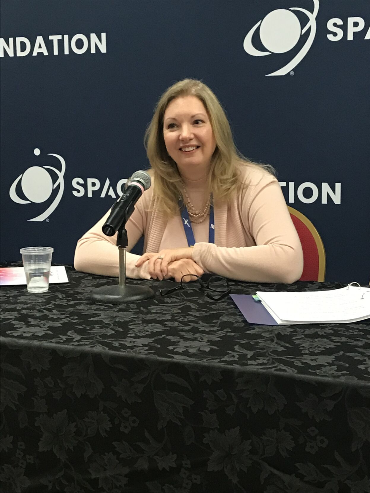 Michele Thompson, program lead for the U.S. Mint's American Women Quarters Program, announces the new Sally Ride commemorative quarter at the Space Symposium on Wednesday. (O'Dell Isaac, The Gazette)