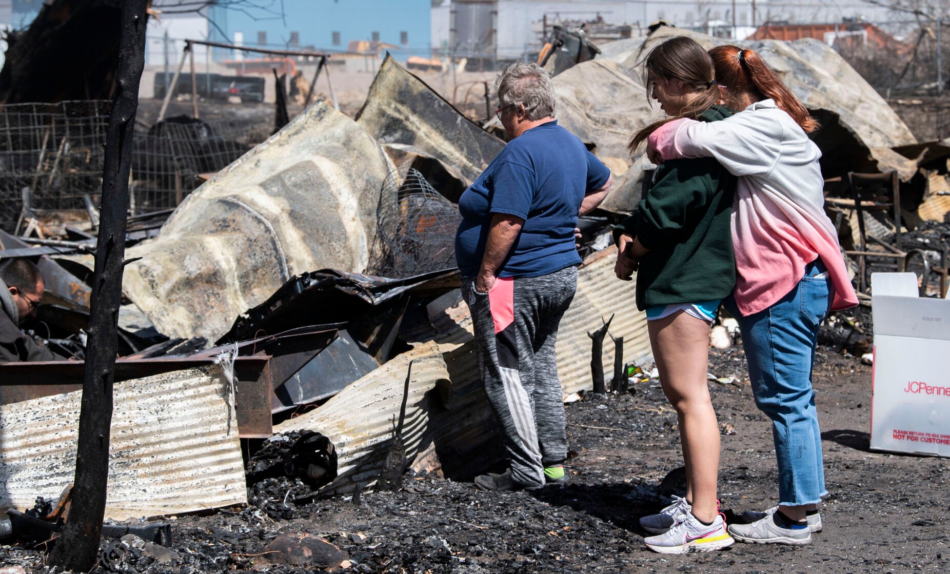 Chandra Campos hugs her daughter Alyssa, 14, as they search through the remains of their home. (Christian Murdock, The Gazette)