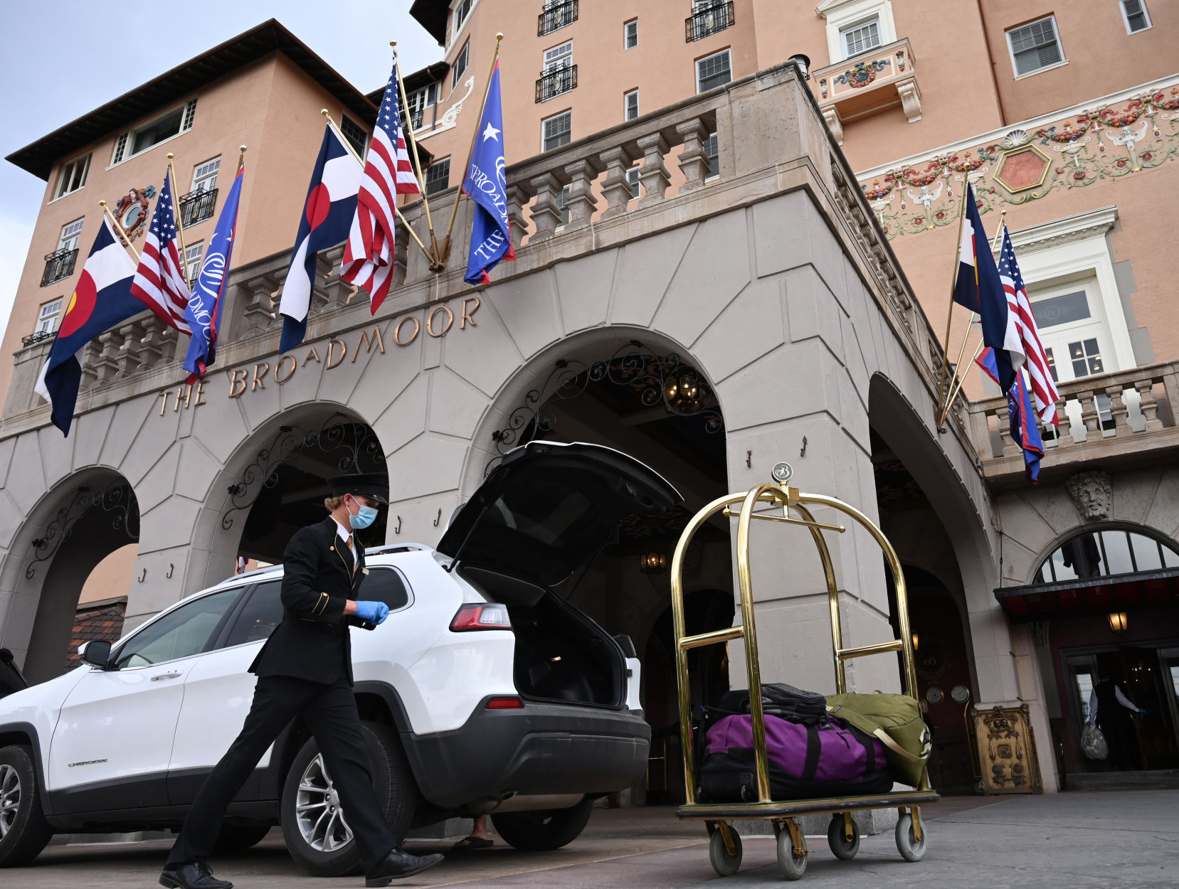The first hotel guests started arriving to the Broadmoor Hotel since it shutdown in March because of COVID-19. Diane and Jim Farley (right, front to back) are taken to their room by Special Services Manager Jessica Colon at the hotel on Sunday, June 28, 2020. (JERILEE BENNETT/THE GAZETTE)