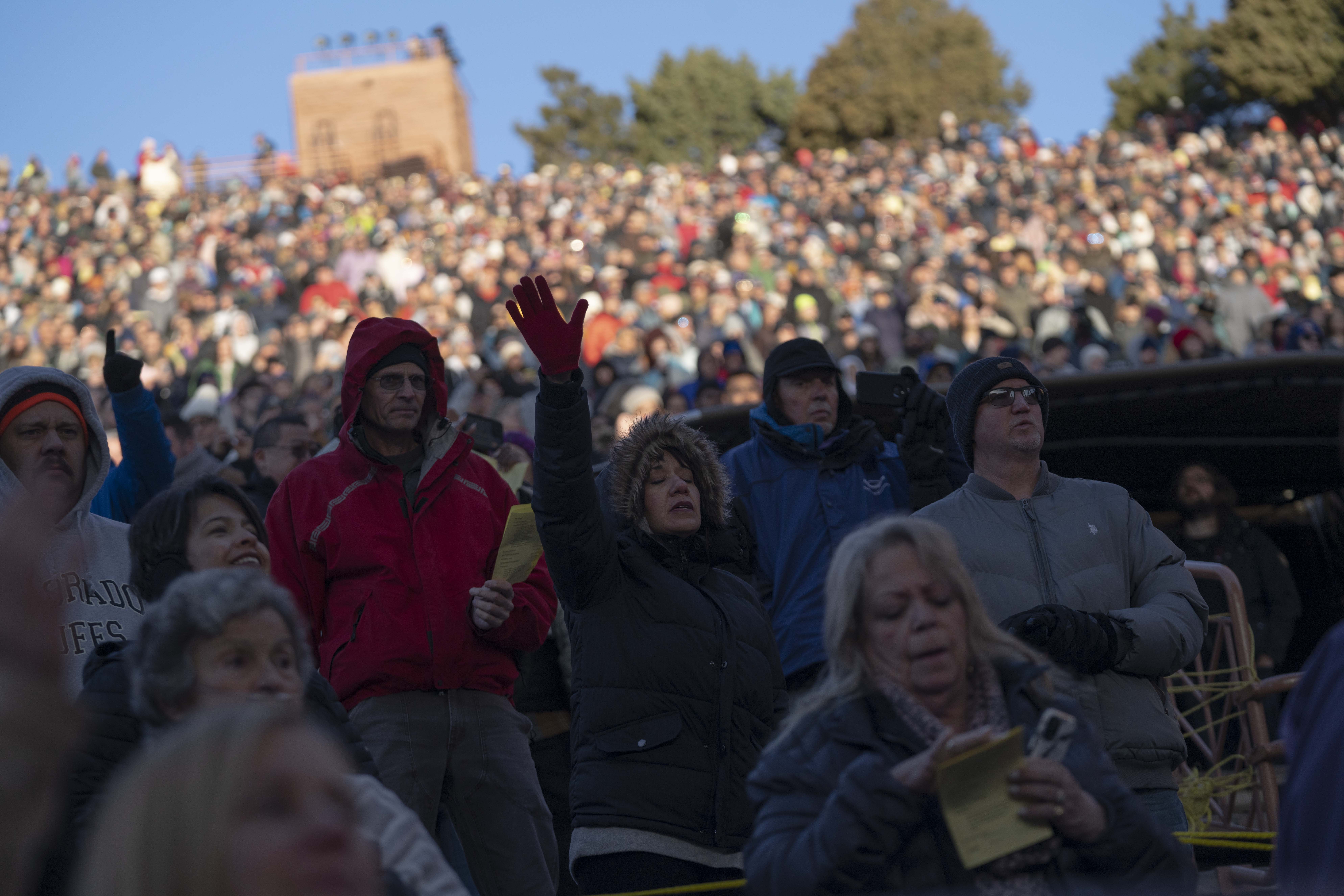 Worshipers listen to a song by the band Blood Brothers during the 75th Annual Easter Sunrise Service on Sunday, April 17, 2022, at Red Rocks Amphitheater in Morrison, Colo. This year’s service was the first in two years due to the COVID-19 pandemic. (Armond Feffer)