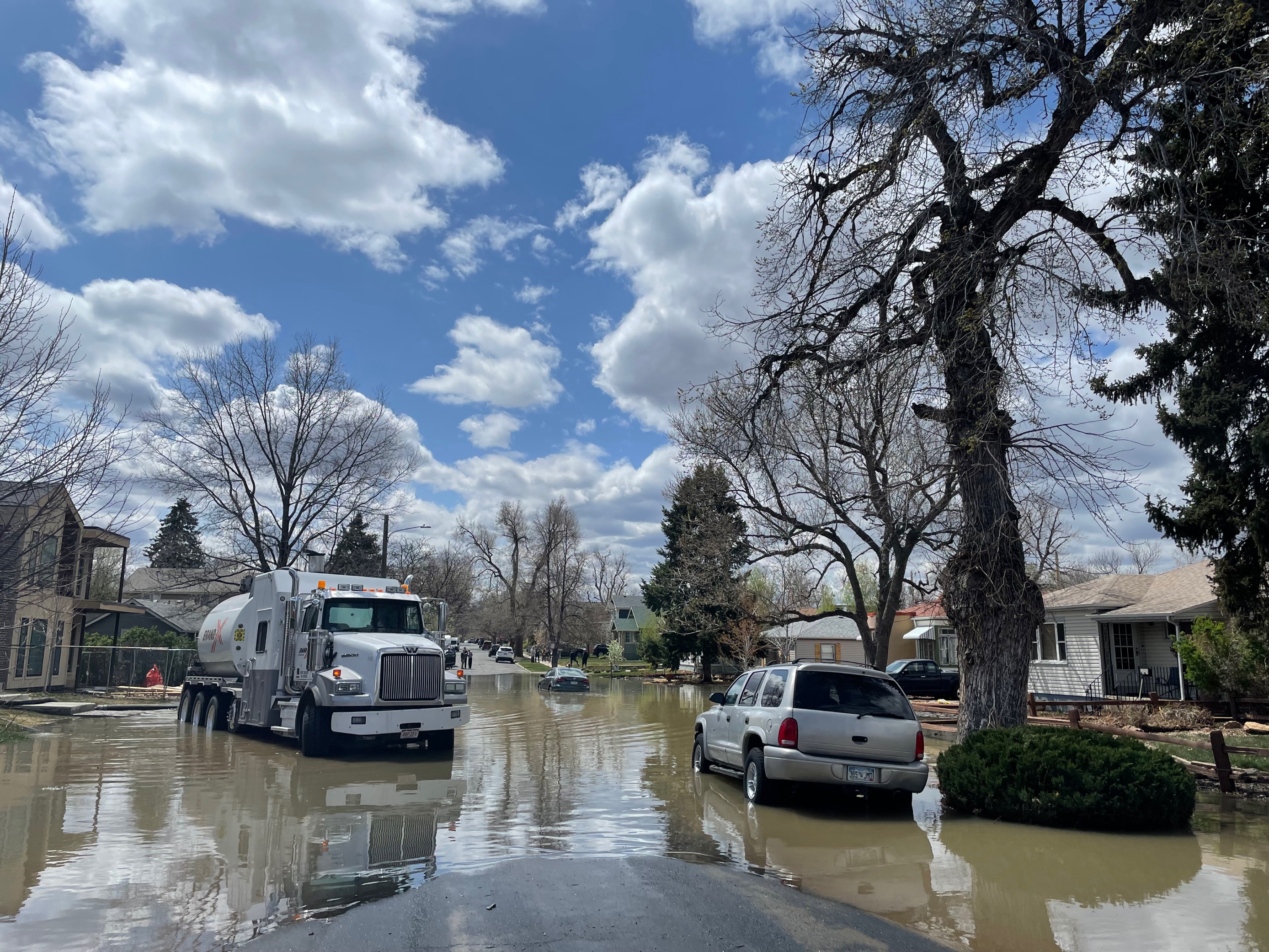 Parts of a street are flooded from a water main break in the Berkeley neighborhood that occurred Sunday, April 24, 2022. (Lindsey Toomer, Denver Gazette) (Lindsey Toomer, Denver Gazette)