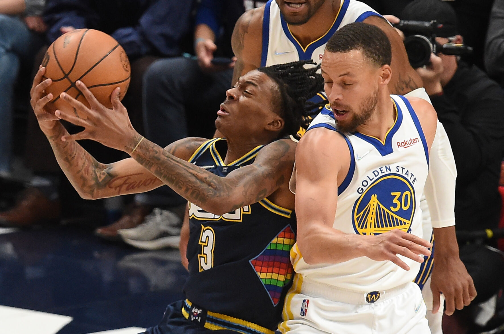 Nuggets Bones Hyland gets fouled by Warriors Steph Curry in the first quarter of game 4 of the first round of the playoffs at Ball Arena on Sunday, April 24, 2022. The Nuggets defeated the Warriors 126-121. (Photo by Jerilee Bennett, The Gazette) (Jerilee Bennett)