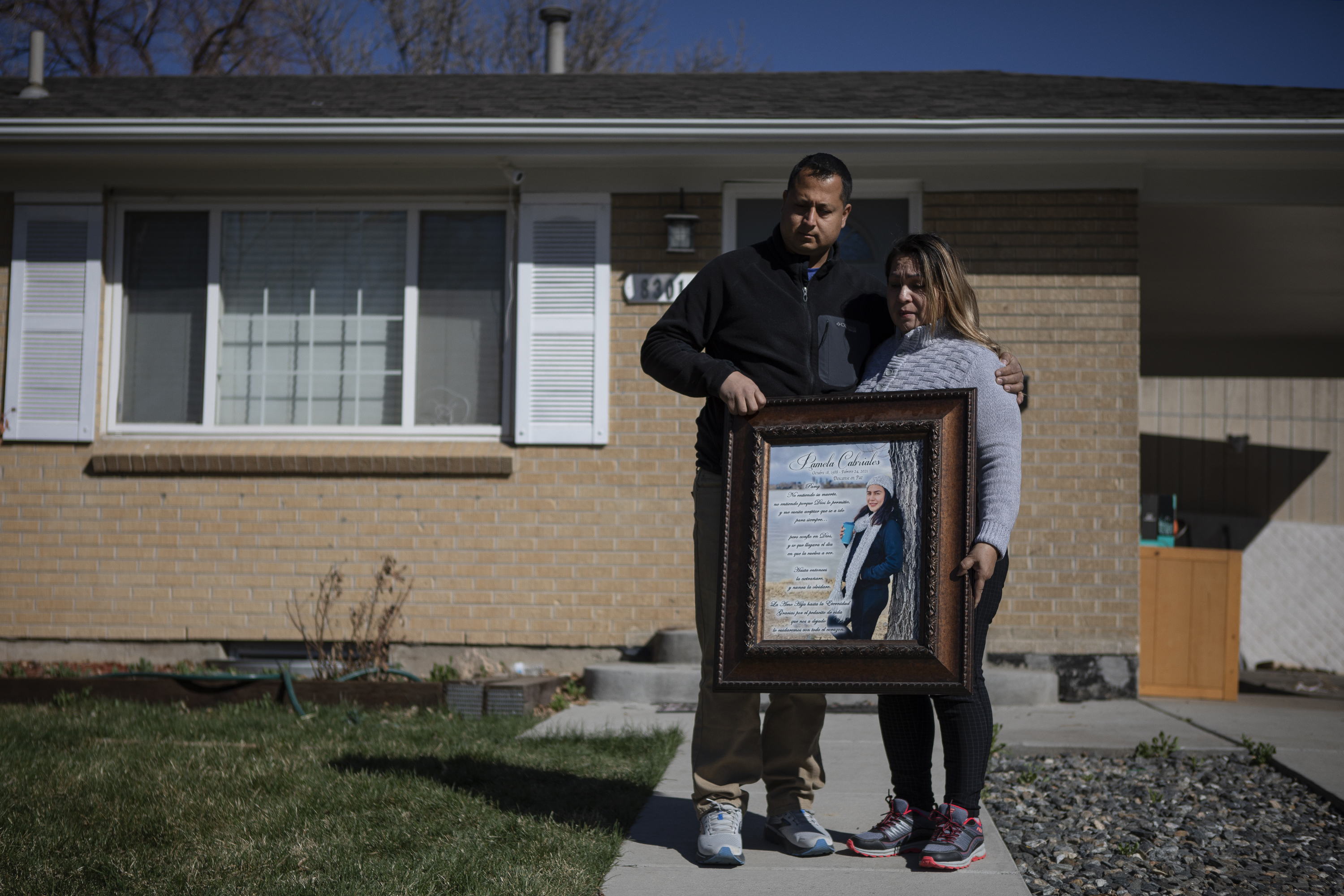 Alex Cabriales and his mother Irma Cabriales hold a portrait of their sister and daughter Pamela Cabriales who was killed on Feb. 24, 2021 by a minor, during a portrait on Wednesday, April 6, 2022, in front of Pamela’s house in Westminster, Colo. (Timothy Hurst/The Denver Gazette) (Timothy Hurst)