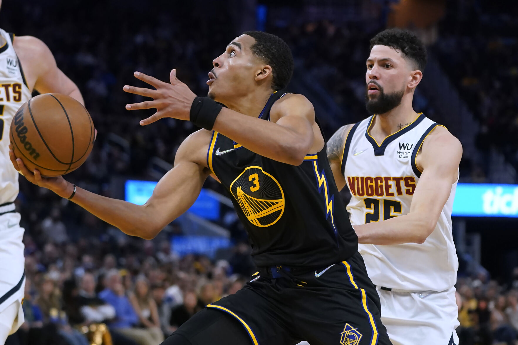 Golden State Warriors guard Jordan Poole (3) shoots against Denver Nuggets guard Austin Rivers during the second half of Game 1 of an NBA basketball first-round playoff series in San Francisco, Saturday, April 16, 2022. (AP Photo/Jeff Chiu) (Jeff Chiu)