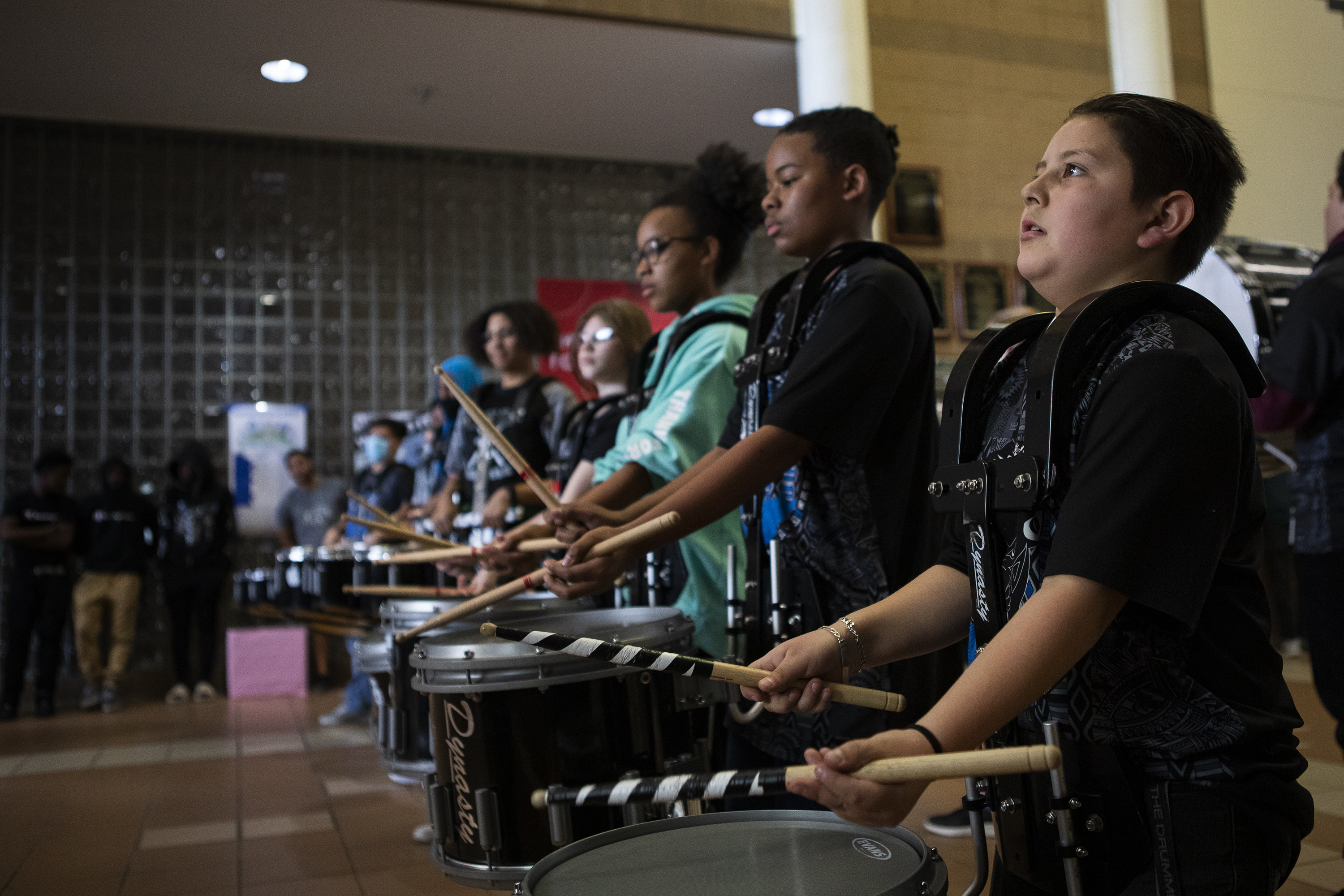 Dr. Martin Luther King, Jr. Early College sixth grader David Villegas, right, plays with the DMLK Drumline during the ribbon cutting ceremony for the first book vending machine in a DPS school on Thursday, April 28, 2022, in Denver, Colo. (Timothy Hurst/The Denver Gazette) (Timothy Hurst)