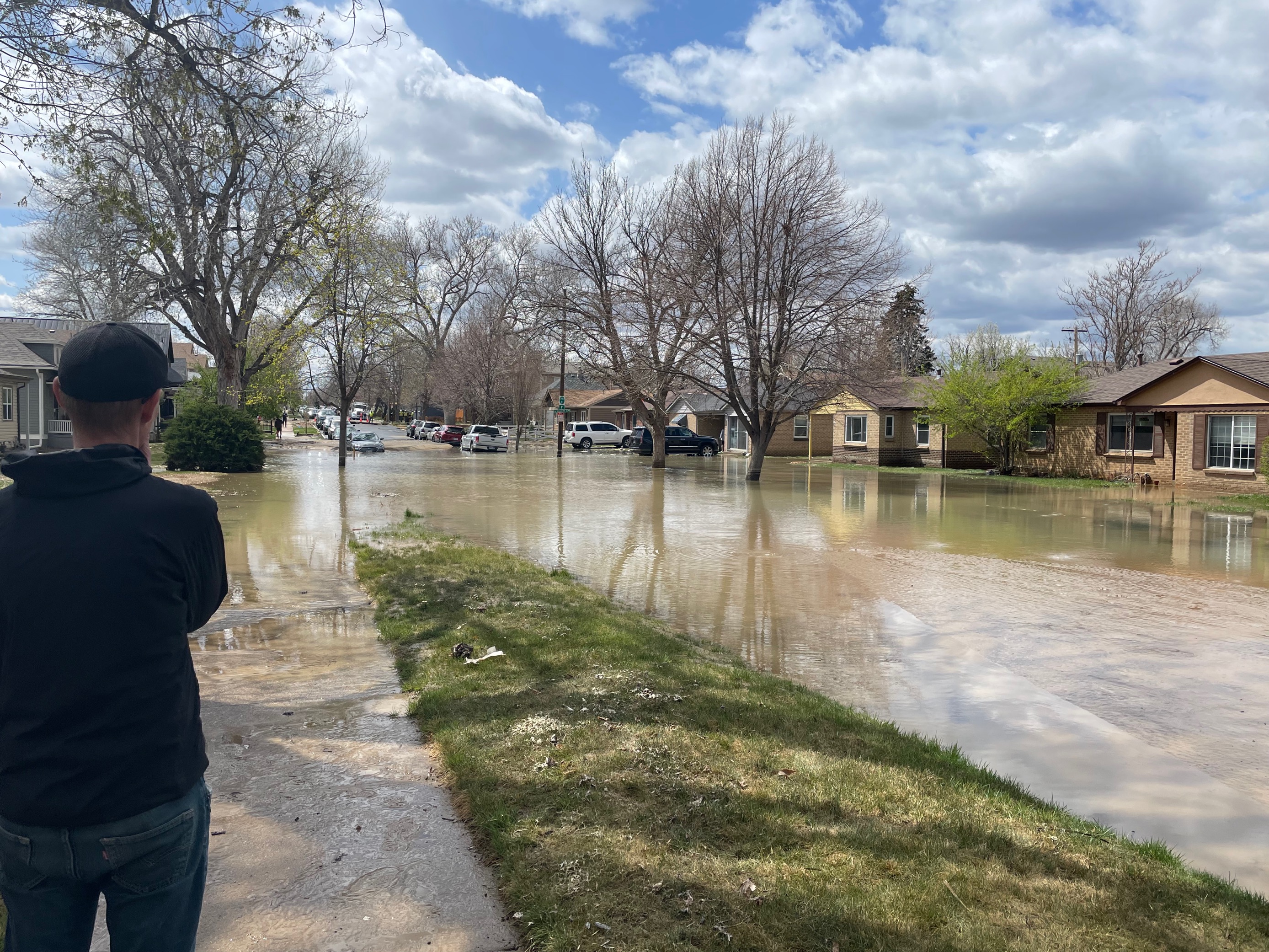 Parts of a street are flooded from a water main break in the Berkeley neighborhood that occurred Sunday, April 24, 2022. (Lindsey Toomer, Denver Gazette) (Lindsey Toomer, Denver Gazette)
