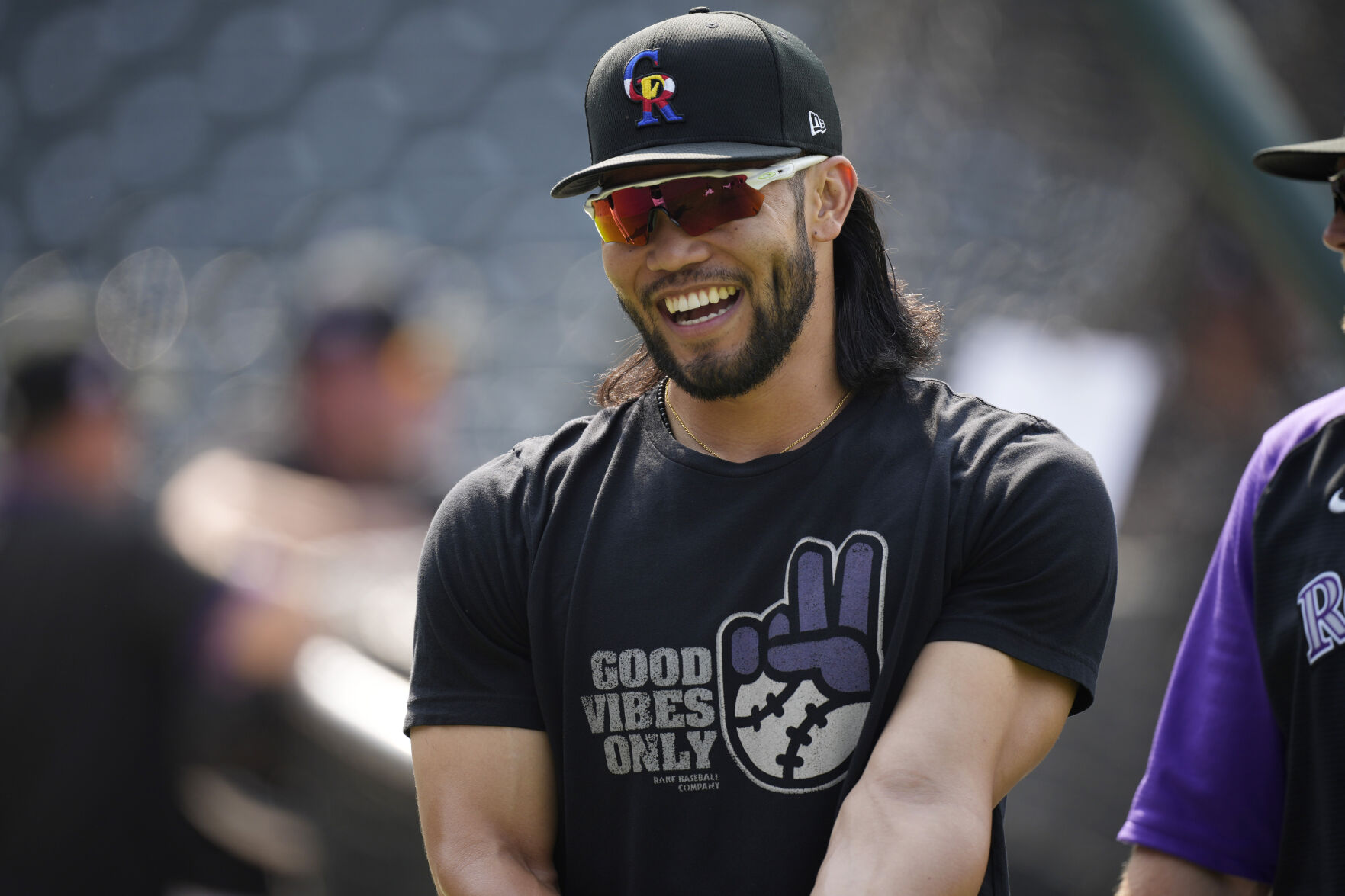 Colorado Rockies third baseman Connor Joe warms up before a baseball game against the San Diego Padres, Aug. 16, 2021, in Denver. (AP Photo/David Zalubowski) (David Zalubowski)