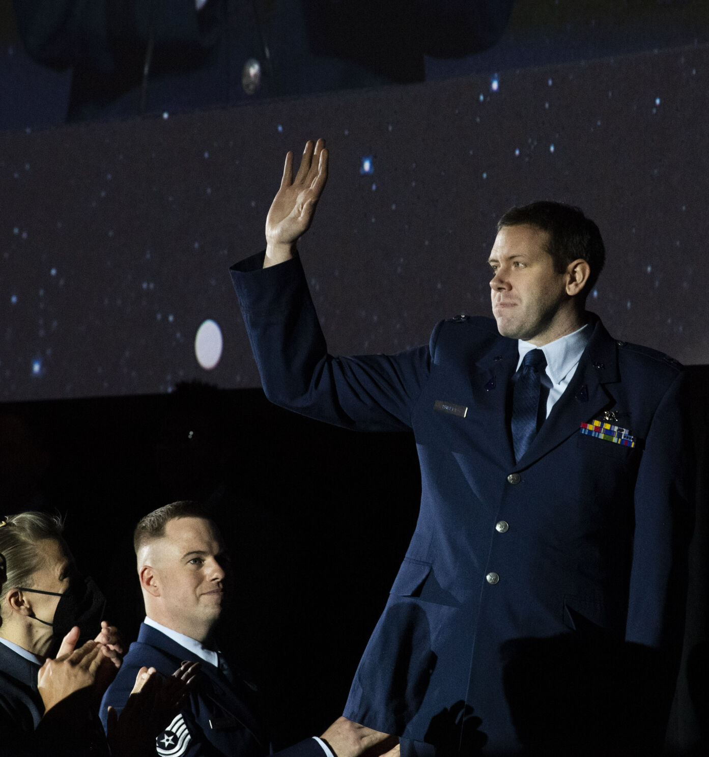 Capt. Scott Hubert waves to the crowd while being recognized by Gen. John W. “Jay” Raymond, Chief of Space Operations, U.S. Space Force, during his talk Tuesday, April 5, 2022, during the 37th Space Symposium at The Boardmoor in Colorado Springs. (The Gazette, Christian Murdock) (Christian Murdock/The Gazette)