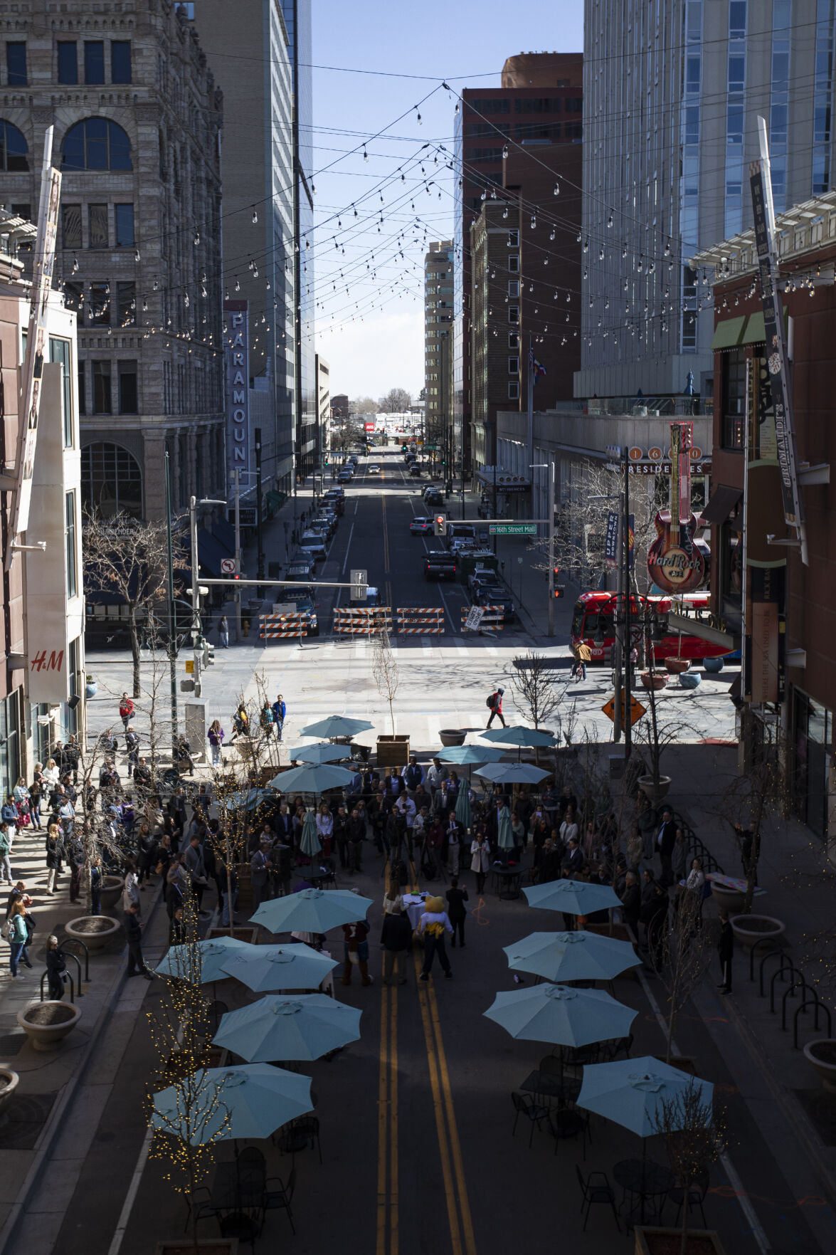 A small crowd is gathered for a press conference discussing downtown Denver’s recovery from the COVID-19 pandemic at the Glenarm Plaza on Thursday, April 7, 2022, in Denver, Colo. (Timothy Hurst/The Denver Gazette) (Timothy Hurst)