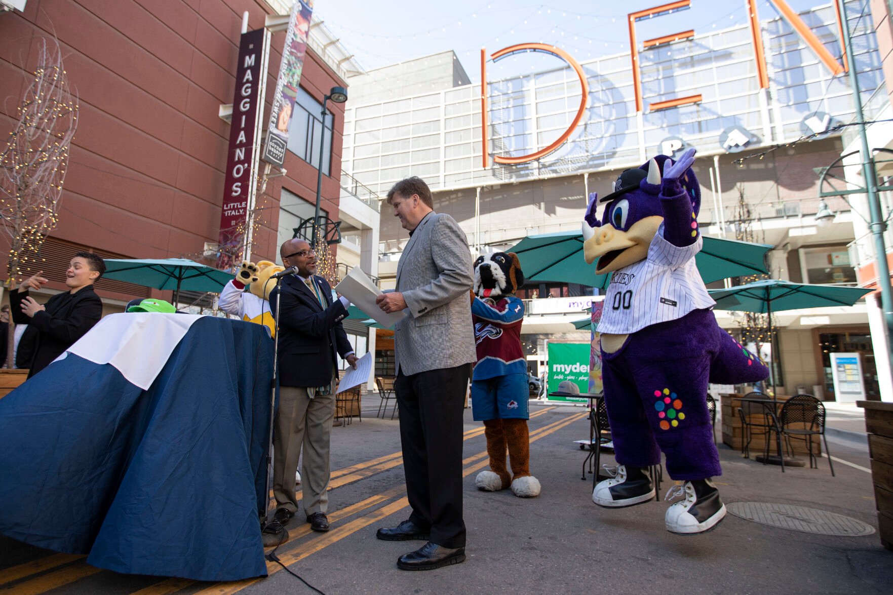 Michael B. Hancock and Rockies President and chief operating officer Gregory Feasel shake hands during a press conference discussing downtown Denver’s recovery from the COVID-19 pandemic at the Glenarm Plaza on Thursday, April 7, 2022, in Denver, Colo. (Timothy Hurst/The Denver Gazette) (Timothy Hurst)