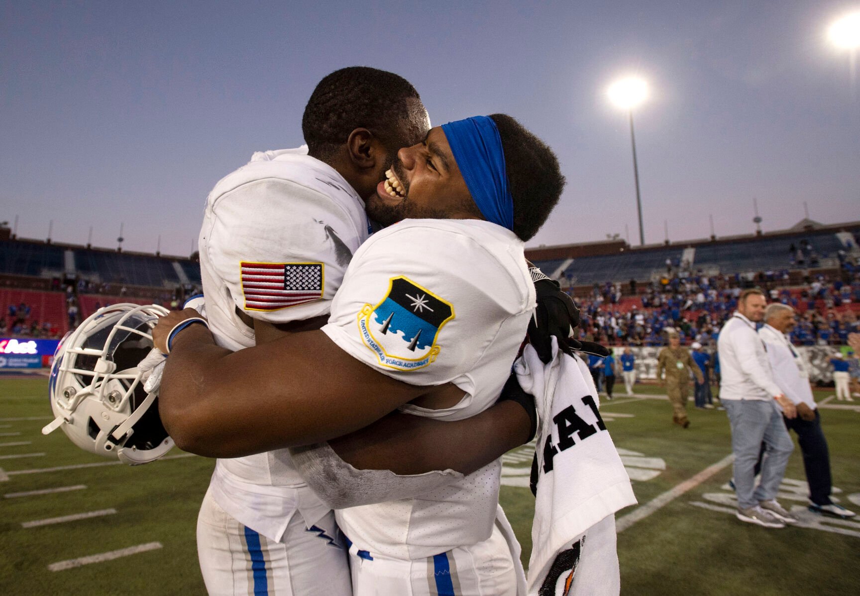 Air Force Falcons junior Zion Kelly (17) and sophomore Jorden Gidrey (15) hug each other as they celebrate their victory after the Air Force Falcons defeat the Louisville Cardinals during the 2021 First Responder Bowl at Gerald J. Ford Stadium on the campus of Southern Methodist University in Dallas, Texas on Tuesday, Dec. 28, 2021. The Falcons won the bowl game by a score of 31-28. (Chancey Bush/ The Gazette) (Chancey Bush/ The Gazette)
