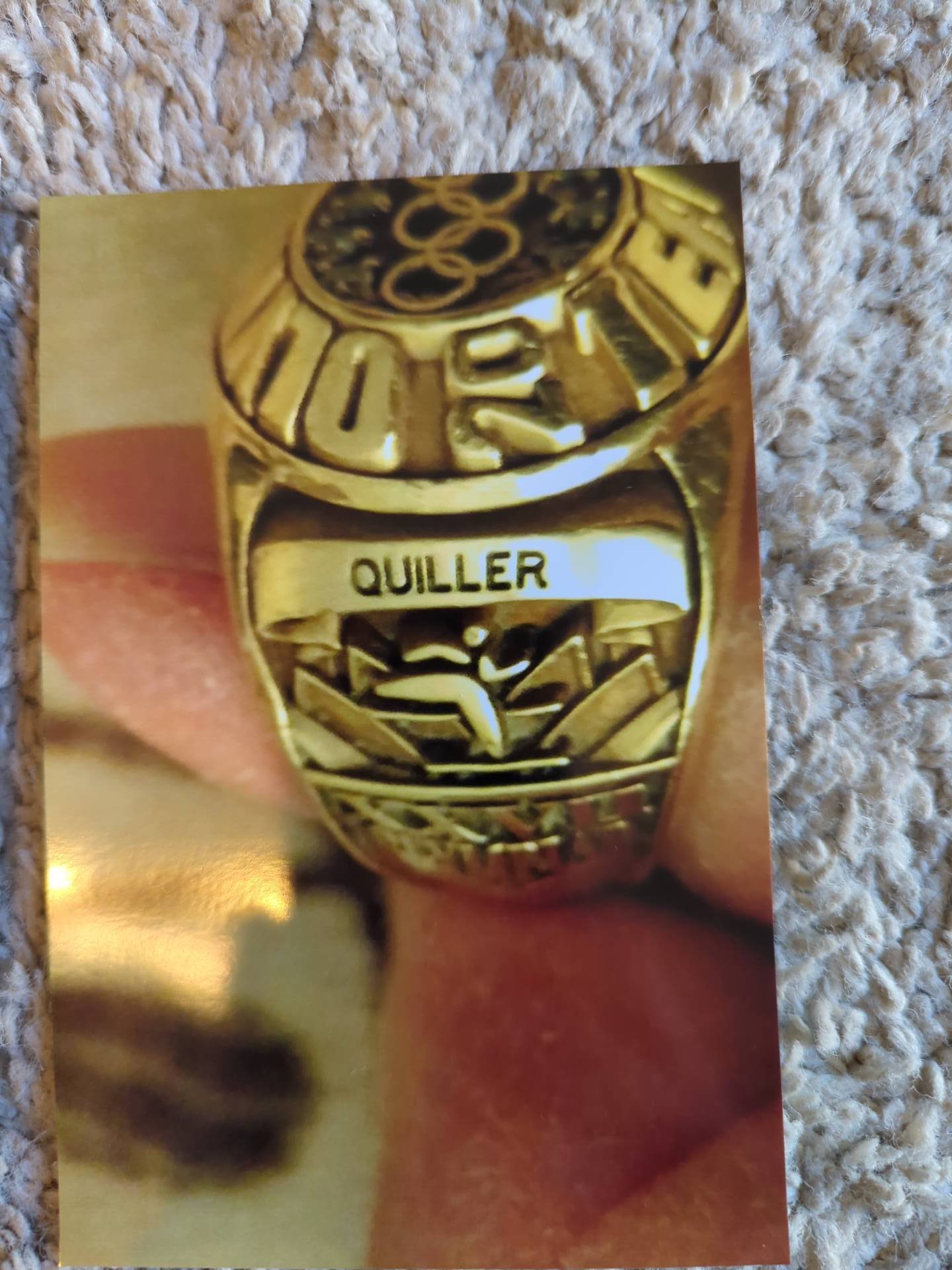 Jerry Quiller had the ring he earned after coaching in the 2000 Sydney Olympics sized down to fit his wife, Sandy. It was lost in the Marshall Fire. (Sandy Quiller)