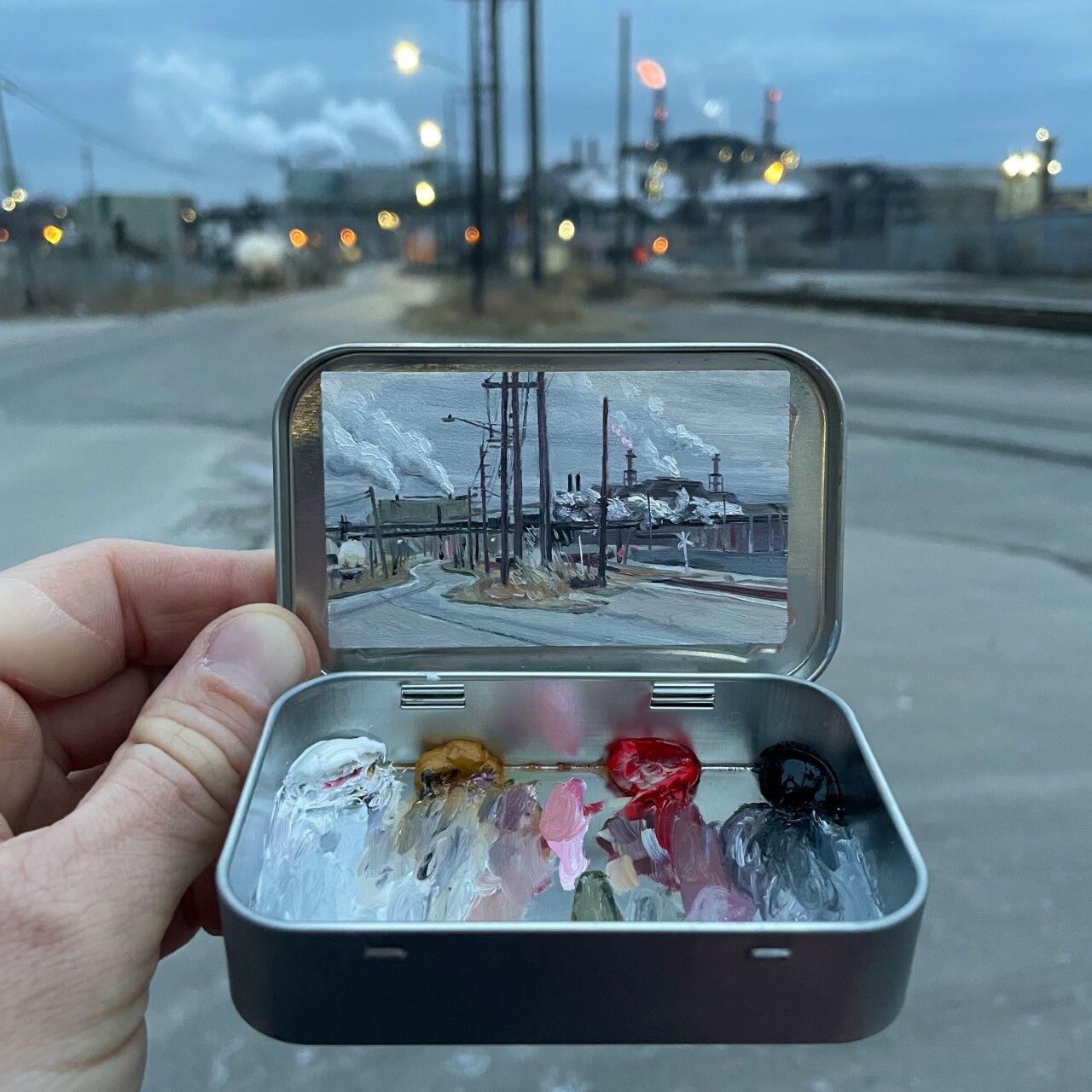Remington Robinson, a Boulder artist, paints miniature plein air murals inside Altoids tins. (Contributed photo)