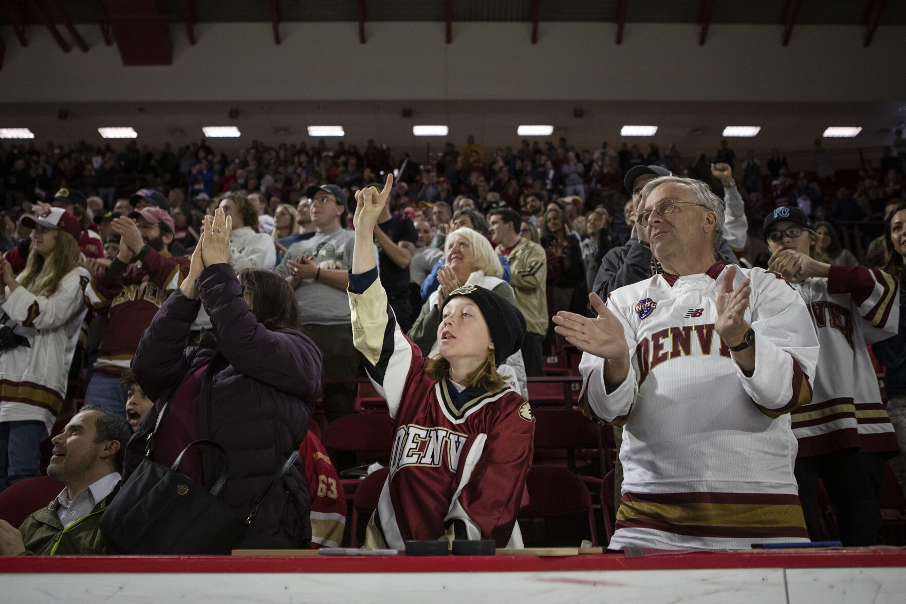 Junior Pioneers goaltender Harrison Tate, 12, cheers from the stands during the 2022 National Championship Celebration for the University of Denver Men’s Hockey Team on Tuesday, April 12, 2022, at Magness Arena in Denver, Colo. (Timothy Hurst/The Denver Gazette) (Timothy Hurst, The Denver Gazette)